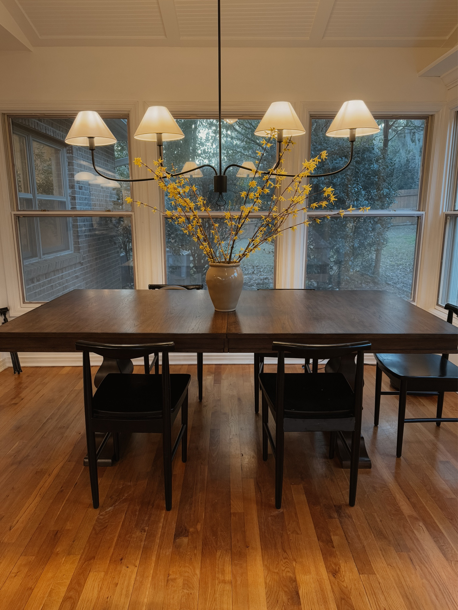 Our new table! Comes with a leaf that takes it fr a 6 seater to 8-10 seater🤎

Vase is clearance at Target right now (not online anymore)
Stems are real from Trader Joe’s 

Dining room table with leaf
Chandelier
Black dining chair


#LTKHome