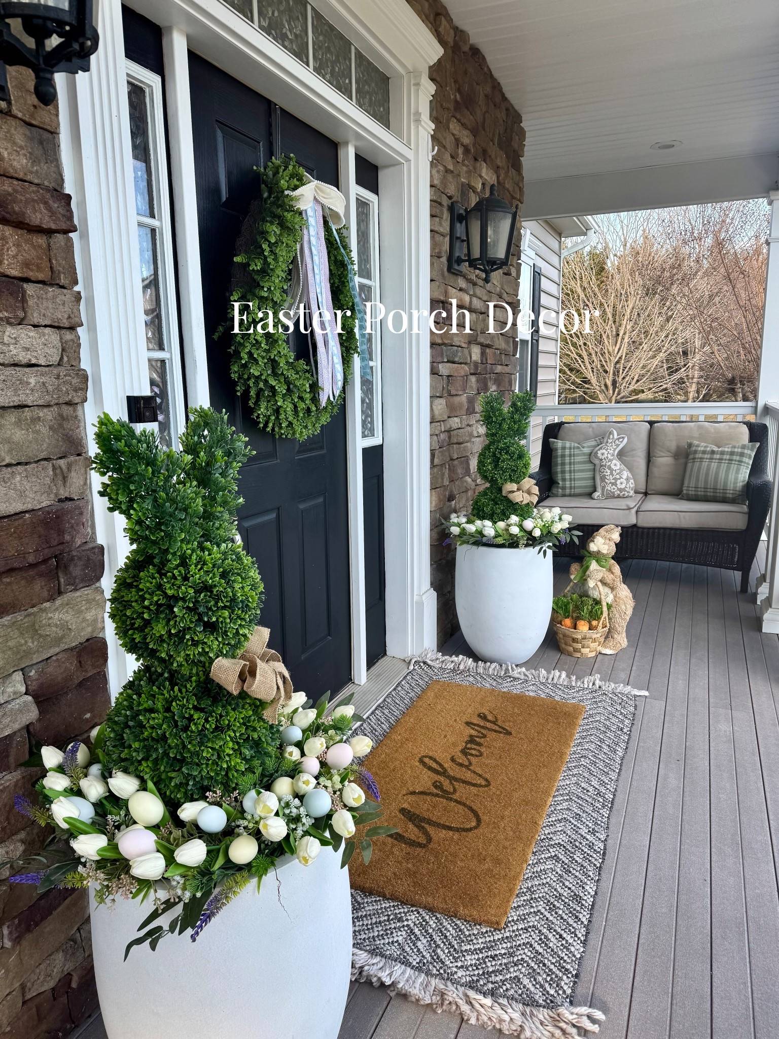 Easter porch decor 🤍 A fresh spring front porch with a green wreath, neutral ribbon, faux topiary trees, and layered doormats for a welcoming seasonal entry. Perfect Easter and spring front door decor.

#EarlySpringDecor #SpringPorchDecor #FrontDoorDecor #FrontPorchDecor #SpringHome
#easterdecor
#easterporch
#easterfrontdoor


#LTKSeasonal #LTKHome