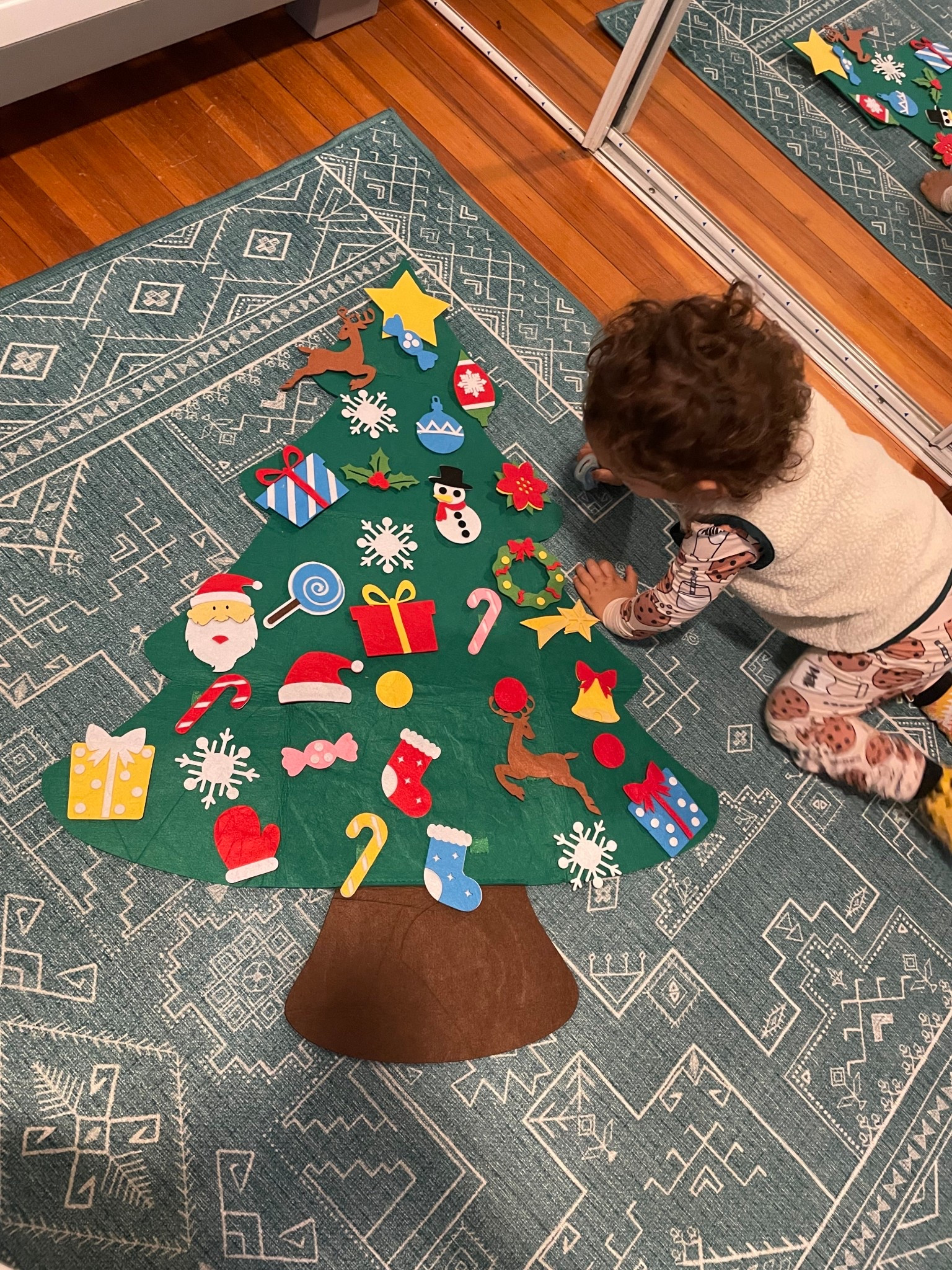 Haven’t even had the chance to hang this cute little toddler tree up yet, but baby is obsessed! How cute is this?!! Comes with optional lights as well!

#LTKHoliday #LTKKids #LTKFindsUnder50