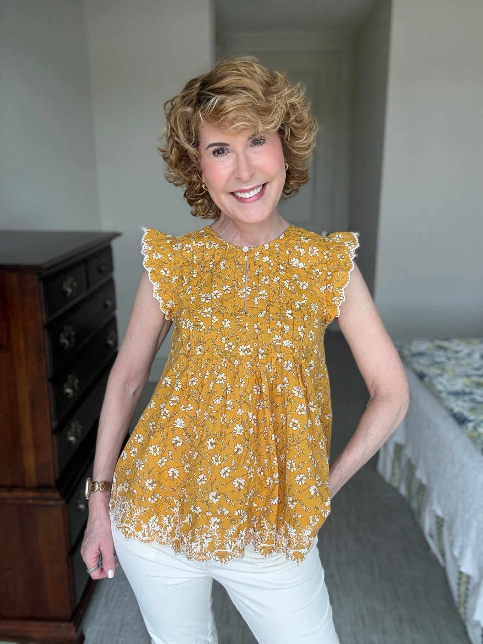Easy fall outfit with an under $20 gold floral blouse featuring flutter sleeves, front pleats, an embroidered border hem, and a relaxed flowy fit. I paired it with cream corduroy jeans and gold sneakers for a casual fall look that’s polished, comfortable, and perfect for fall fashion over 50.