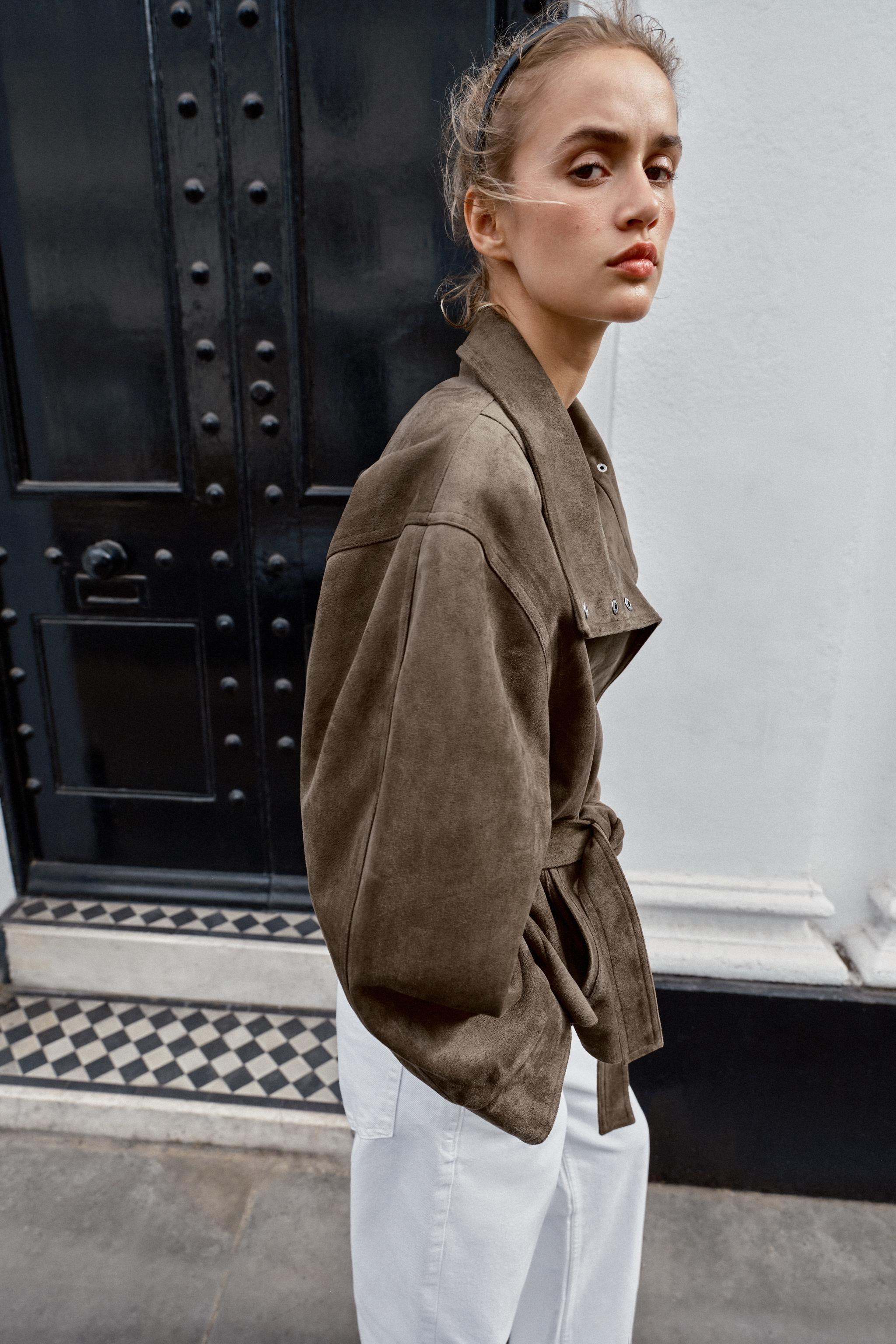 Jacket with a high collar and long sleeves. Front pockets. Featuring a matching fabric belt and g... | Zara UK