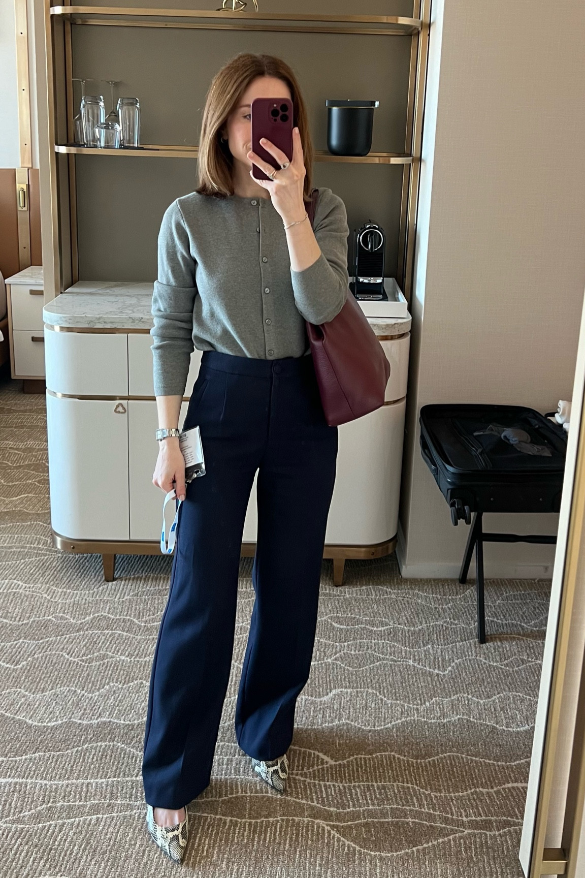 Work conference outfit idea
J.crew Grey cardigan
Sezane Navy blue wide leg trousers 
Aeyde Snake print sling back 

#LTKworkwear #LTKstyletip