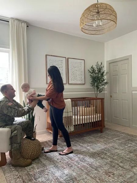 My baby boy is getting a big boy room so I had to share some pics from his nursery! We installed a rattan overhead light, fake olive branch and a light green/gray finish for the ultimate neutral boy nursery. Nursery DIY, boy nursery, neutral nursery, home remodel

#LTKkids #LTKhome
