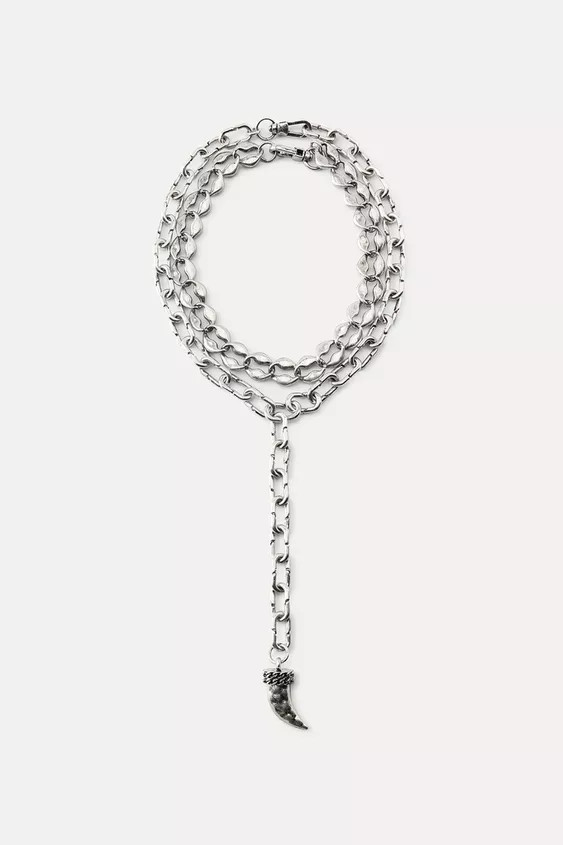 Long double metal link necklace of different lengths. Horn-shaped pendant. Lobster clasp closure. | Zara US