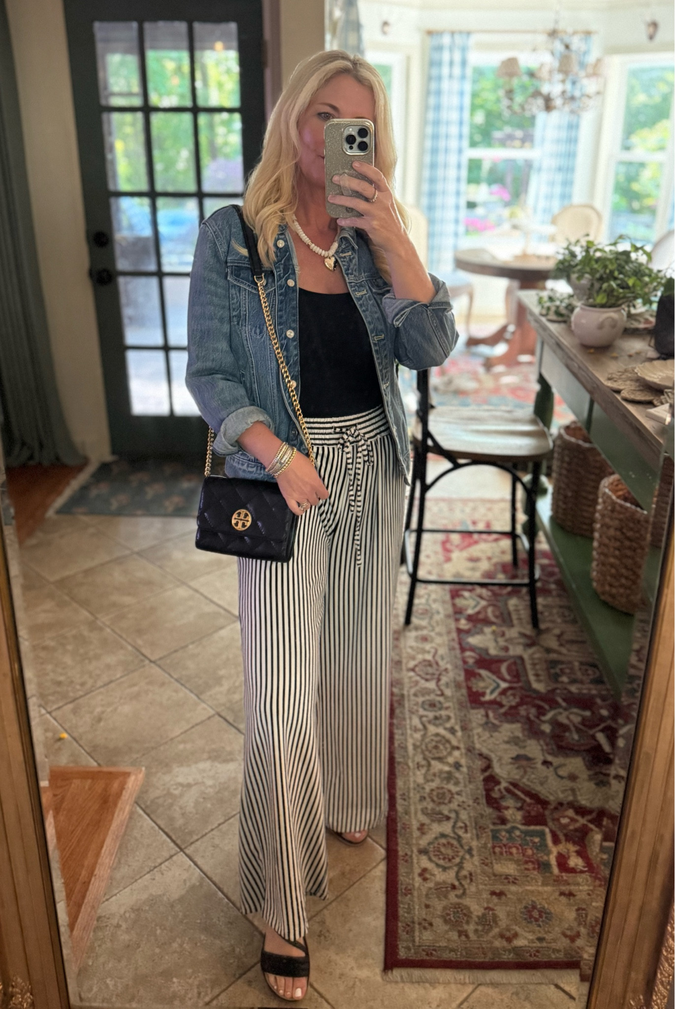 Casual dae night outfit… Women’s denim jacket, wide leg striped pants, dressy black sandals, Tory Burch quilted purse, square neck double lined tank top, heart necklace 

#LTKootd #LTKOver40 #LTKSaleAlert