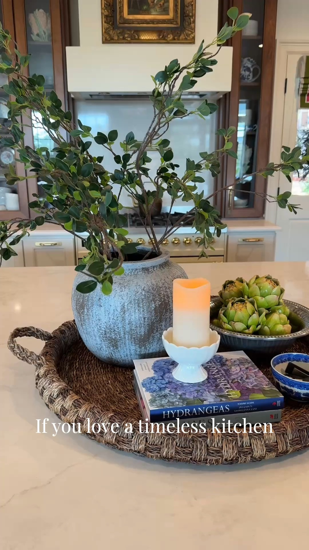 Kitchen Island Styling That Feels Collected, Not Cluttered

One of my favorite ways to style a kitchen island is by grouping a few timeless pieces on a large woven tray. A beautiful pottery vase with faux stems, a favorite coffee table book, a flickering candle, vintage-inspired blue and white accents, and seasonal artichokes create a look that feels warm, collected, and easy to live with. These are the little details that make a house feel like home. 🤍#KitchenStyling #CollectedHome #RalphLaurenInspired #BlueAndWhiteDecor #KitchenIslandDecor

#LTKHome
