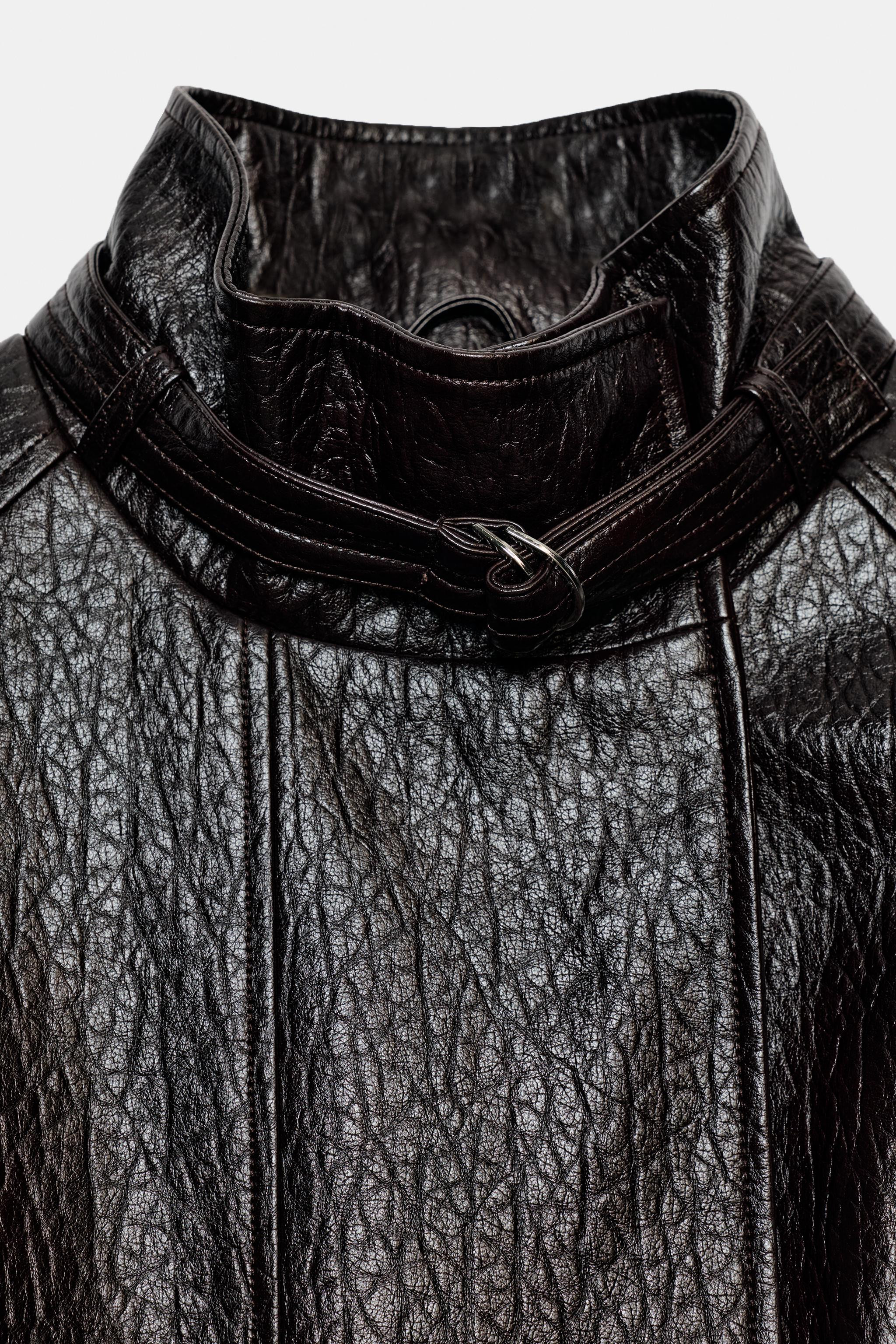 Faux leather jacket featuring a stand-up collar with a tab and long sleeves with finished cuffs. ... | Zara US