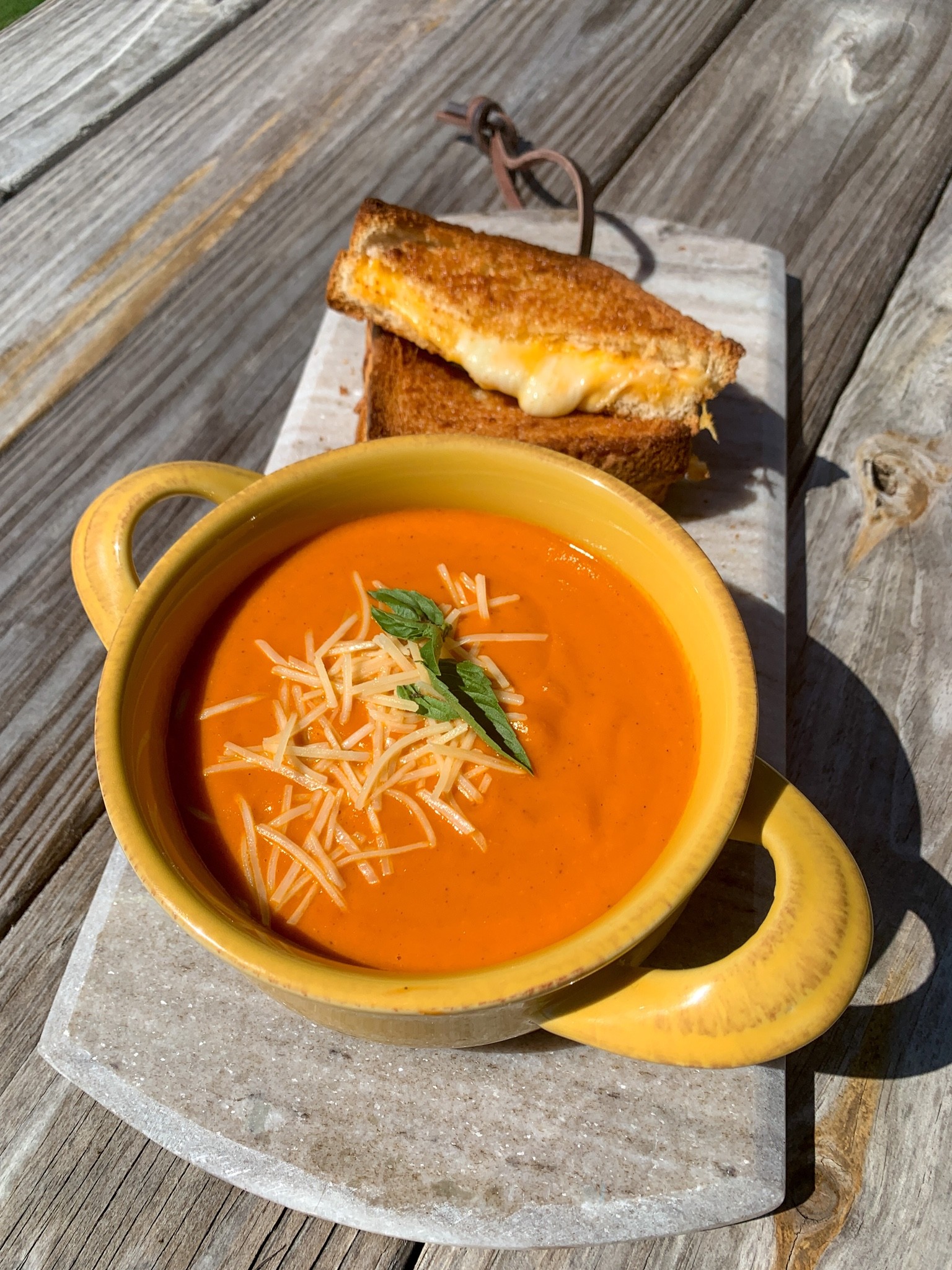 Serving up a classic dish, Tomato Basil Soup with grilled cheese. #ClassicDish #TomatoBasilSoup #Soups #SoupBowls #Marbleboards #Foodie 

#LTKHoliday #LTKhome