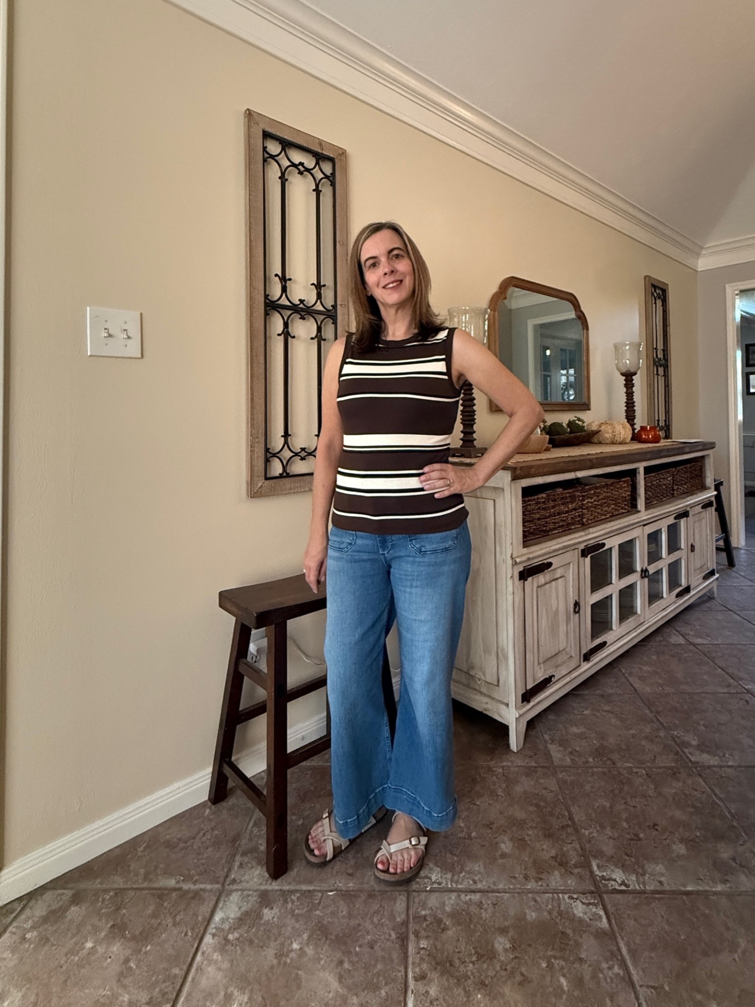 We don’t have the weather for Fall yet, but I can definitely wear Fall colors 🤎 I’m wearing a brown and white striped sleeveless top with far denim wide leg  jeans. ✨ fall fashion | fall clothes | fall wardrobe | summer to fall fashion | fall outfits women over 50

#LTKdayinmylife #LTKOver40 #LTKPetite