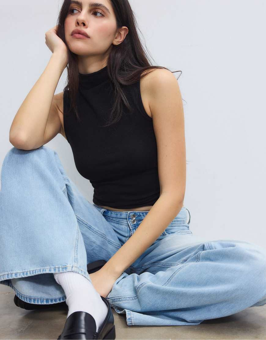 Stradivarius Sleeveless funnel neck t-shirt in black | ASOS (Global)