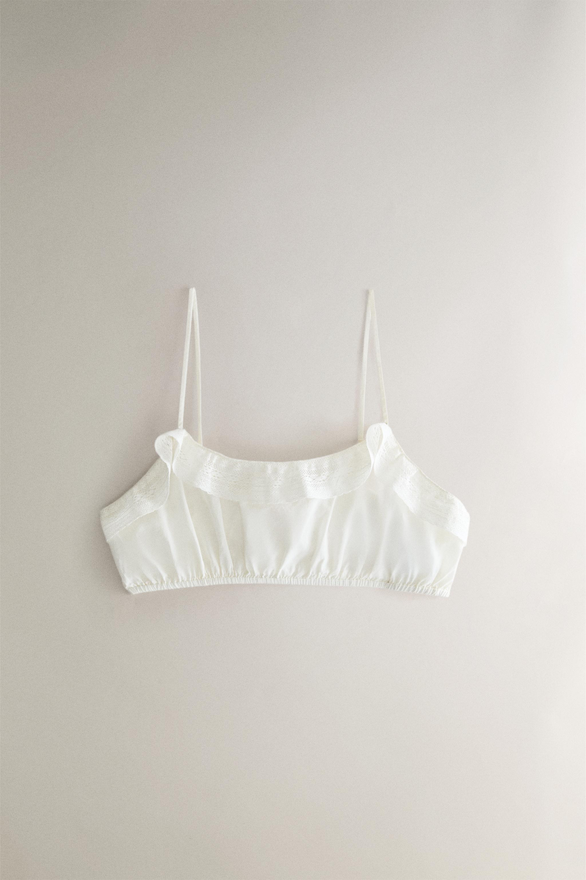 Short top made of cotton. Plain design with lace ruffle detail. Thin straps and ruched finish. | Zara US