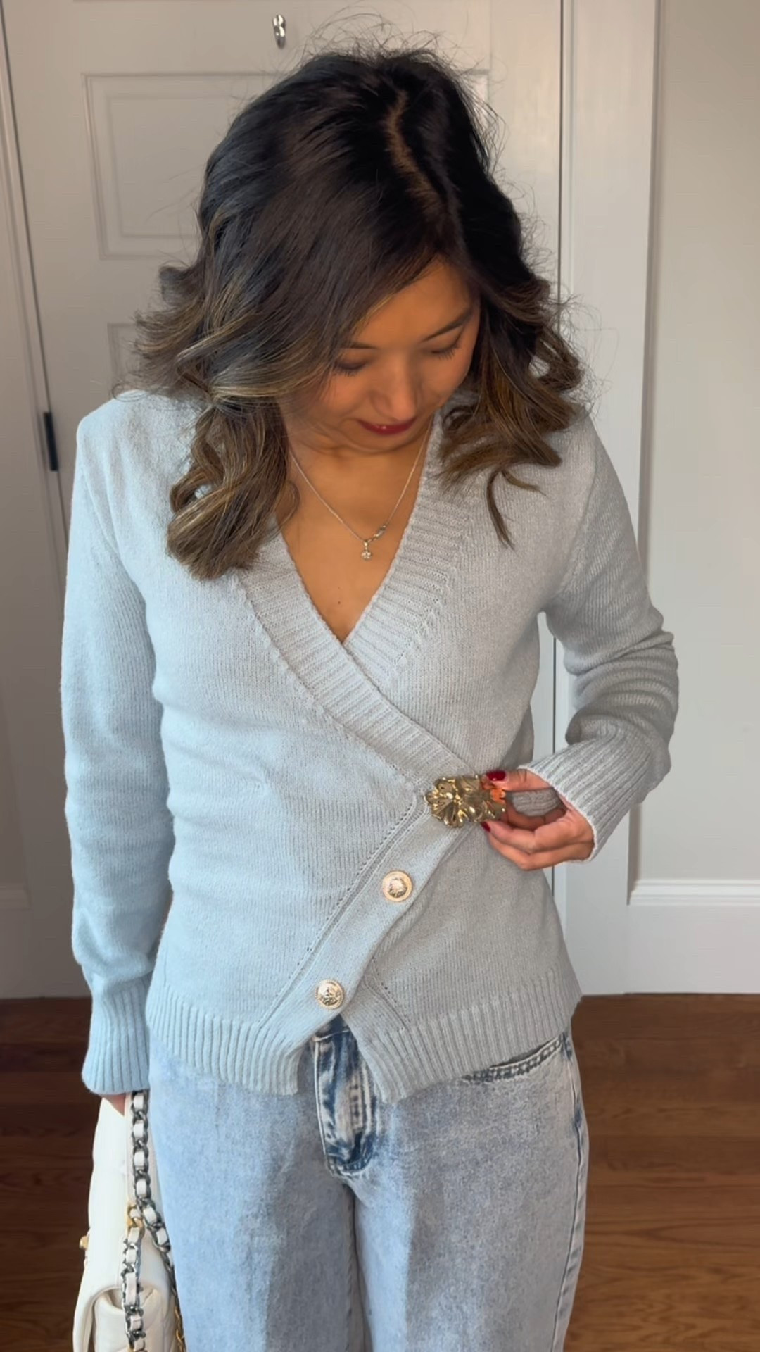 Pretty winter sweater! 🩵❄️ Love this baby blue color, the ribbed and the wrap detail, the unique gold buttons, and the tie in the back 👌🏻

#LTKootd #LTKFindsUnder50