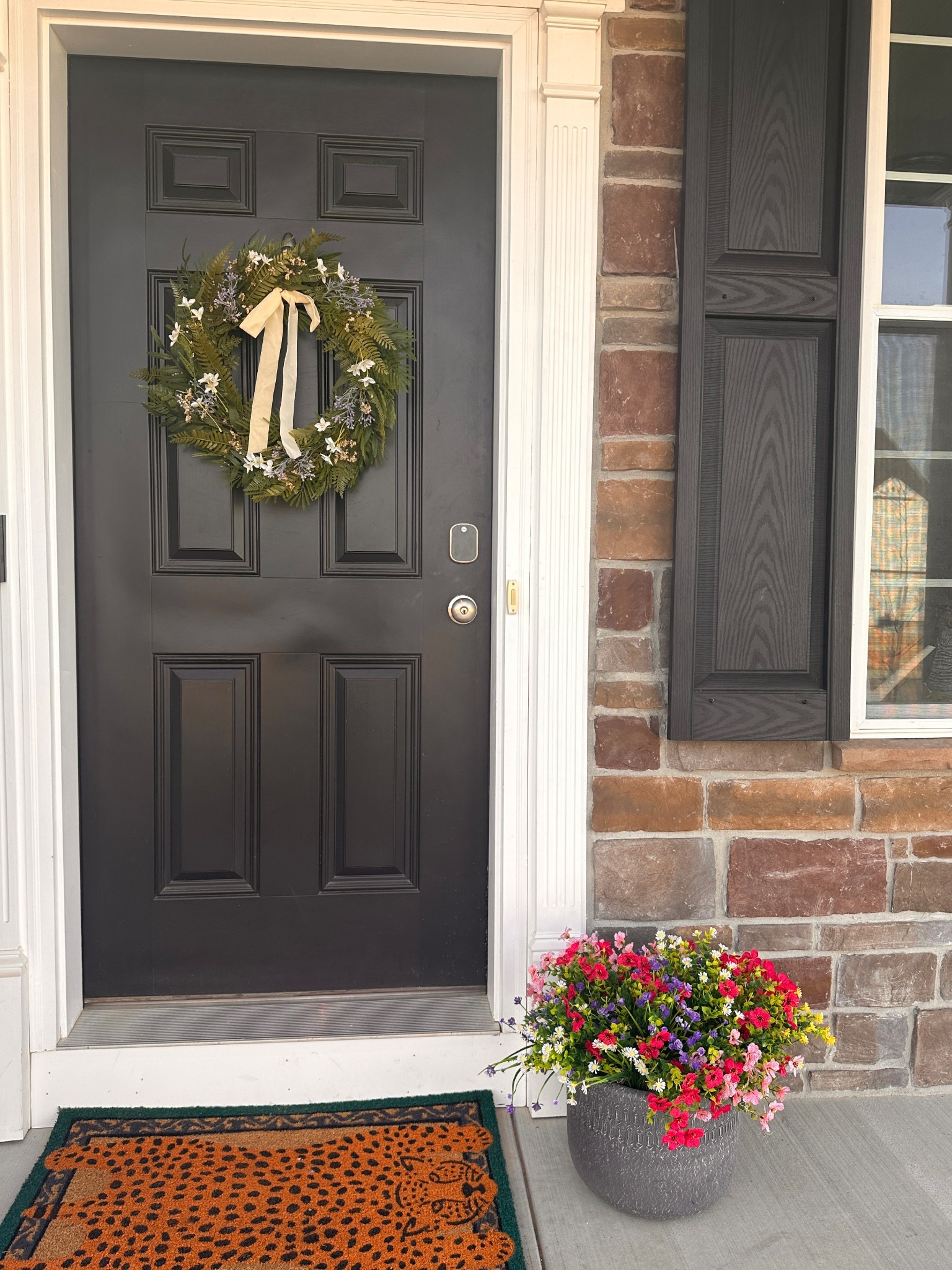 The most non-aesthetic front porch which is so on brand for Sam😂 The rug is under $10 from Sam’s Club, the flowers are fake, and the wreath is on clearance.

An Amazon box is holding said fake flowers up. Pot is 13.5” from Walmart last year (I have another one to go on the other side).

Also 10/10 don’t recommend shutters in front of a stone wall…linking the bird spikes that got rid of them nesting back there.

#LTKHome #LTKSaleAlert #LTKSeasonal