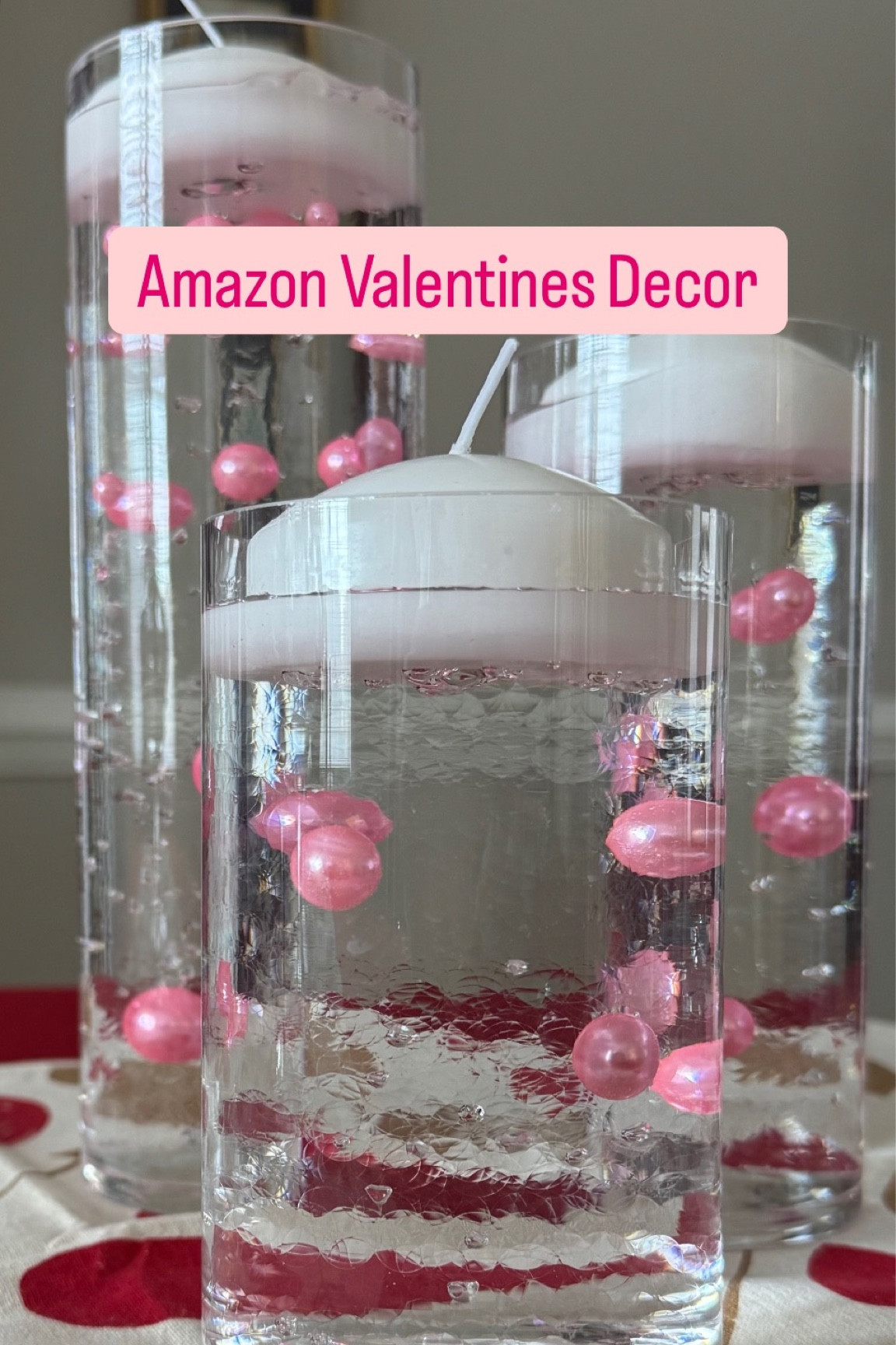 ✨ DIY Valentine’s Day Decor Idea! ✨
 
Looking for a simple yet stunning centerpiece? 💖 This easy DIY will add that perfect romantic touch to your home for Valentine’s Day. 🌹
 
What I used:
🏺🏺🏺 3 Glass Cylinder Vases 
💧✨ Water Beads
💖🌸 Valentine’s Pink Vase Filler Pearls
🕯️🕯️ Floating Candles
 
How to Do It:
1) Moisten your water beads and let them expand for a few hours.
2) Layer the beads with your Valentine’s Pink Pearls.
3) Fill your vase with water, leaving space at the top for the floating candle.
4) Top it off with a floating candle.
5) Voilà! You’ve got a dreamy, romantic centerpiece in minutes. ✨
 
This centerpiece is SO functional – you can place it anywhere: your kitchen counter, dining room, end table, or even the kitchen table! 💖
 
Don’t have three cylinder vases? No worries! You can use ANY vase you have—just get creative with what you’ve got! 💡
 
DIY ~ Valentine’s Day ~ Easy ~ Centerpiece ~ Romantic ~ Décor ~ Simple ~ Quick ~ Affordable ~ Home Décor ~ Candle ~ Crafting ~ Valentine’s Décor

#LTKHome
