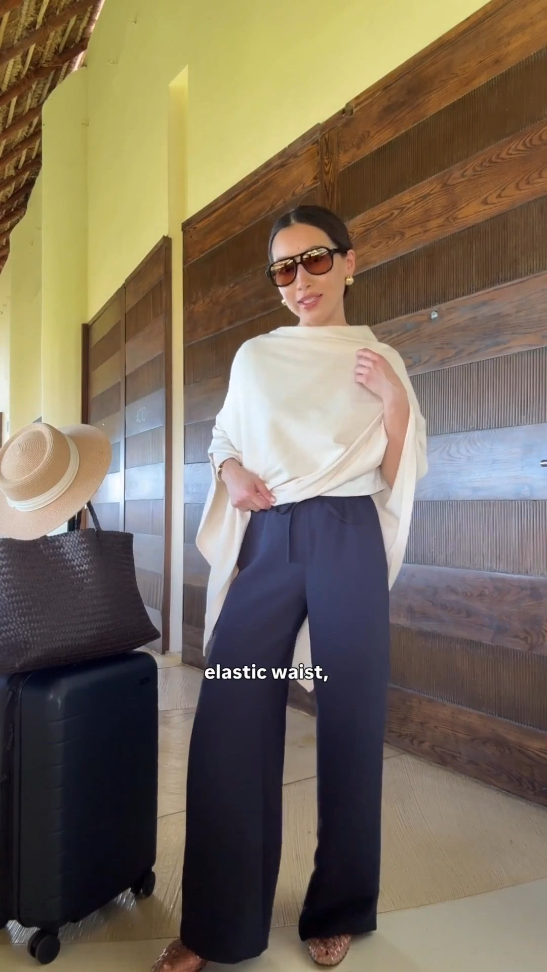 Navy pants in short back in stock
• Aritzia trousers 2XS short 28.5” runs long for petites, i have also purchased regular sizing and hem them. Drapey fabric, stretch waist, wrinkle resistant. 
• Amazon poncho sweater scarf wrap “A-beige ” thinner weight but good for planes and warmer destinations
• lululemon cropped t-shirt size xxxs organic cotton, perfect petite friendly length
• Dolce Vita jelly flats size 5, size down if you're a half size
• Madewell woven leather tote - My favorite work / mom / travel bag that fits my laptop and much more
• Madewell aviator sunglasses
• Amazon packable sunhat with an adjustable inner fit. I’ve owned this for years 
• Away the bigger flex carry-on suitcase, lightweight, roomy size and durable. I've traveled a lot with this.

Petite friendly travel outfit, family vacation, easy mom outfit

#LTKPetite #LTKTravel #LTKootd