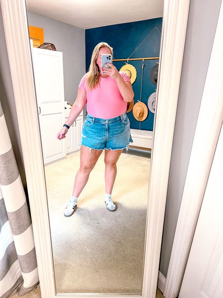 Name a better combo than a hot pink bodysuit and cute jean shorts…. 

These jeans shorts are perfect for us curvy gals - they fit the vibes and leave no gapping in the back. The perfect length to show a little leg but not be too short and love the raw hem. 

Paired with my Adidas Sambas make a great spring outfit option that is on trend. 

I’m wearing a 35 (Size 20) in the shorts and a XXL in the top. I sized up one in the shorts because I prefer a looser fit. 

Size 18 
Size 20 
Plus size jean shorts 
Plus size denim shorts
Plus size outfit 
Plus size spring outfit  

#LTKfindsunder100 #LTKover40 #LTKSeasonal