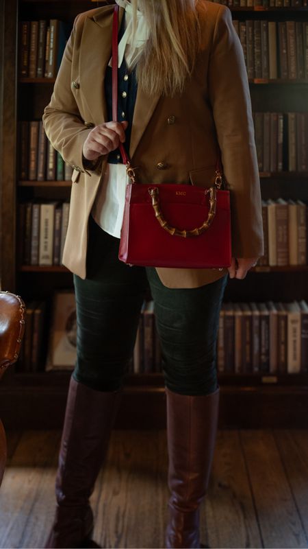 Fall outfit: camel blazer, white silk ruffle shirt, cashmere vest, green corduroy pants, brown knee high leather boots, red leather bamboo crossbody bag

#LTKitbag #LTKSeasonal #LTKover40