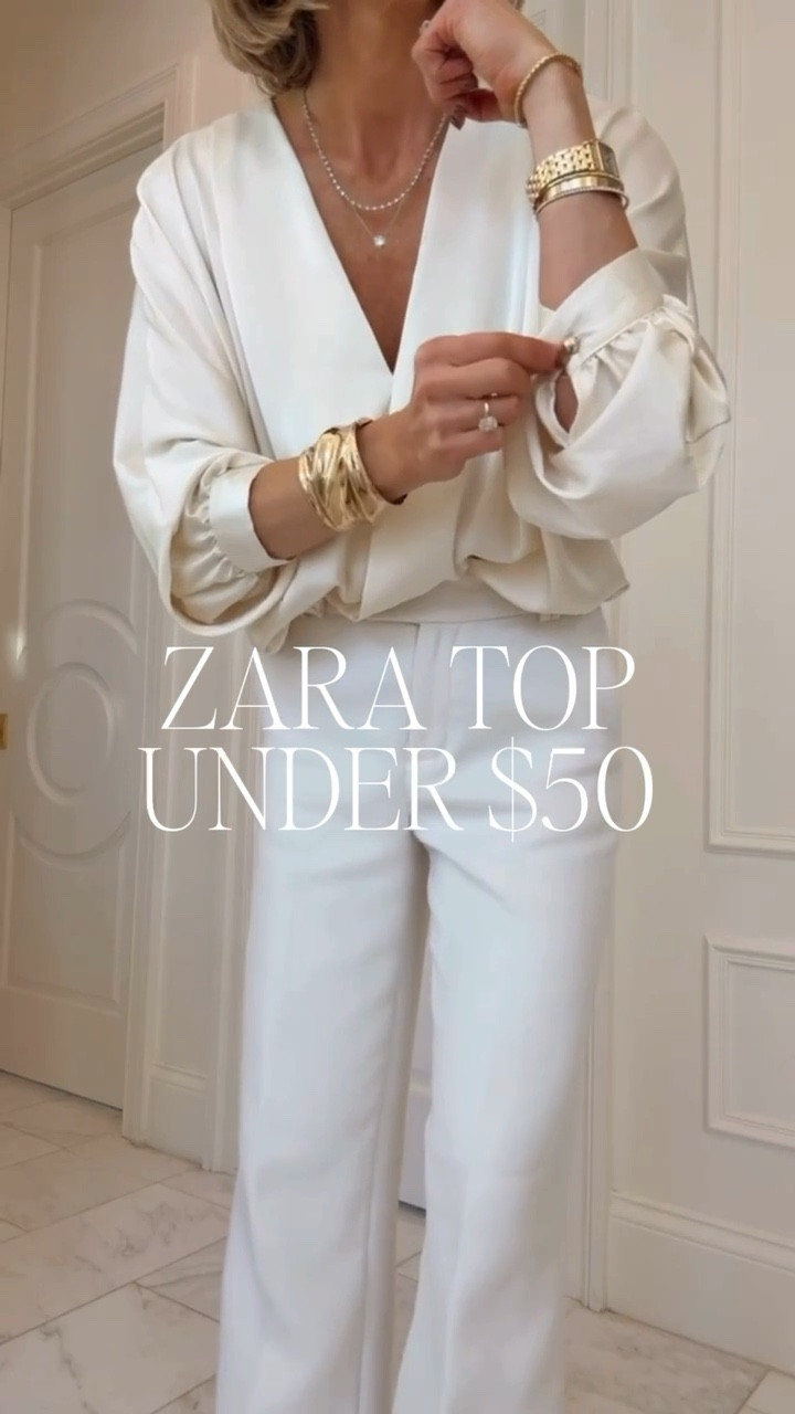 This gorgeous wrap satin top is a steal under $50. 