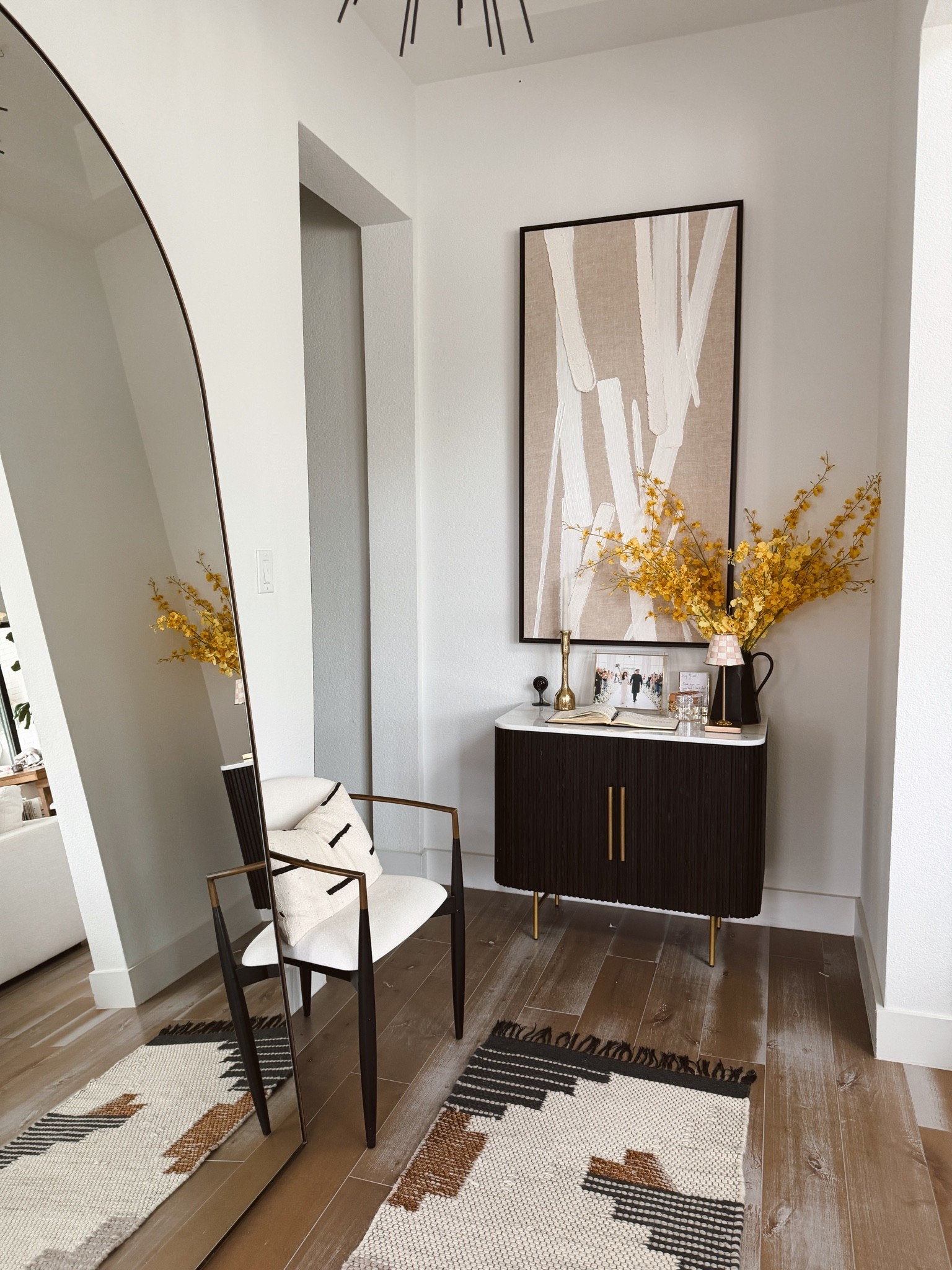 Spring entryway with faux florals, entryway rug, and grand mirror. Love this space in my home!

#LTKHome