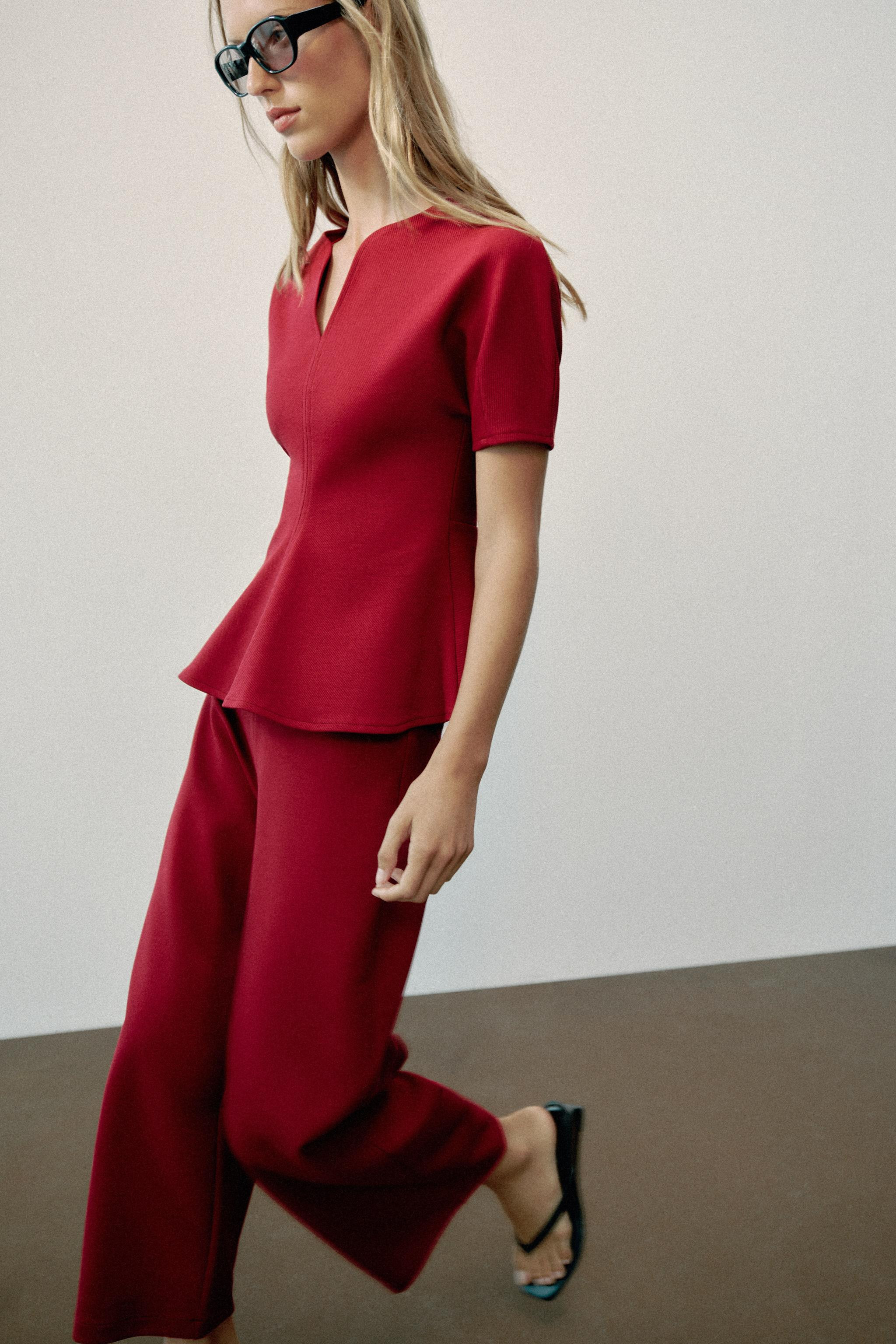 Model height: 177 cmTop made from a cotton blend yarn. Featuring a V-neck, short puff sleeves and... | Zara UK