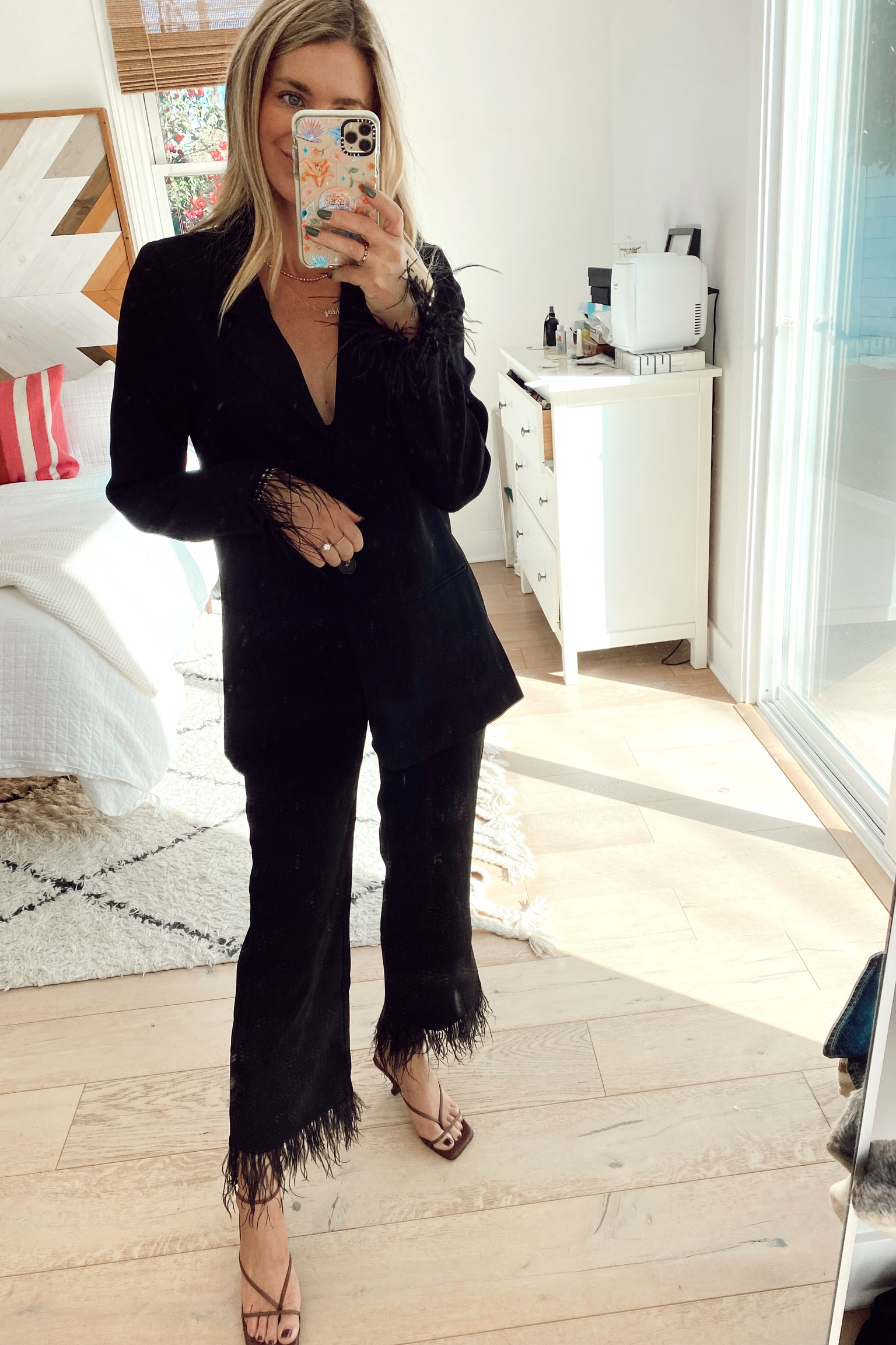 Black feather trim blazer and pants. So cute for holiday events  

#LTKunder100 #LTKSeasonal #LTKsalealert
