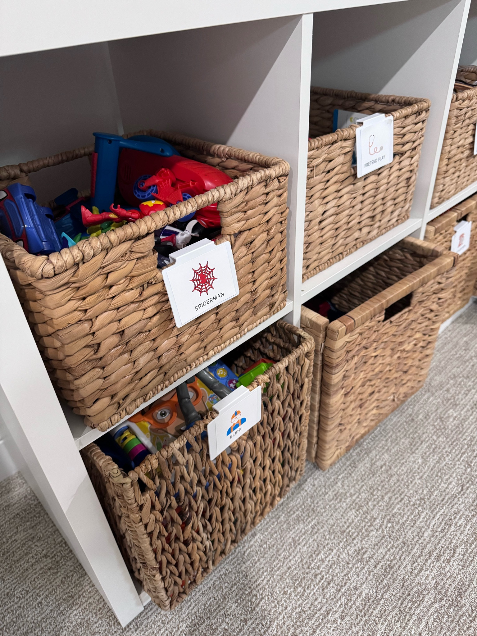 Toy organization. The 8 cubes shelves are from idea, along with larger baskets. The smaller baskets are from Container store  