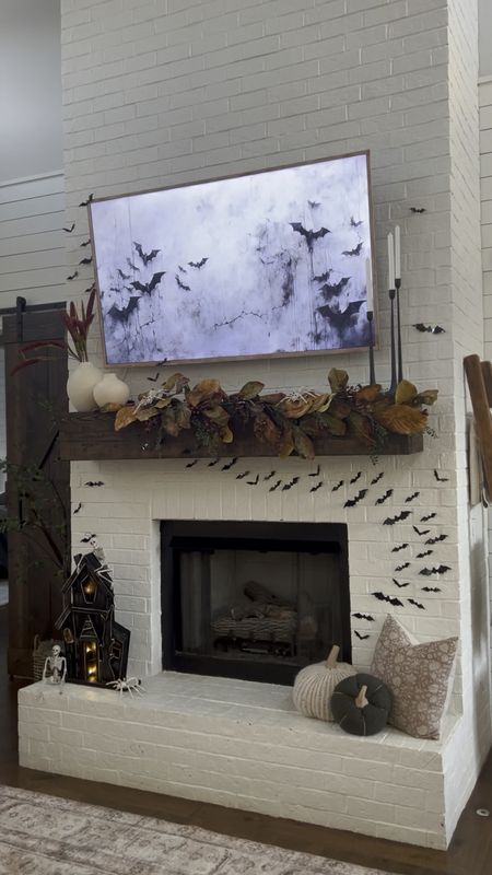 Fall and Halloween home decor mantle mantel fireplace bats magnolia garland black, iron, candle, sticks, candleholders, sorghum, wheat, stems, haunted house, prop, fall, throw pillows, pillow covers, plush knit, pumpkins, miniature skeletons, and spiders fun for the kids! Halloween home accents 

#LTKSeasonal #LTKhome #LTKHalloween
