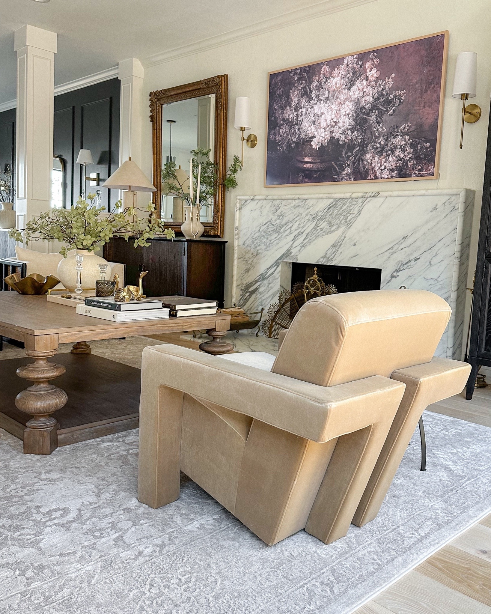 Living room views including this unique accent chair from Amazon! The velvet fabric is gorgeous! A little lower to the ground but not in a weird way, it’s very comfortable to sit in! My rug is in the Beige/Cream!

#LTKfindsunder100 #LTKhome #LTKstyletip