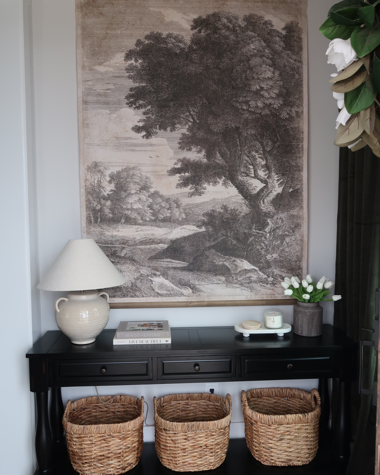 Entryway | Magnolia wall tapestry, black console table with baskets, studio McGee threshold table lamp, Amazon home accessories, faux tulips, spring decor, green velvet curtains.

#LTKFamily #LTKHome