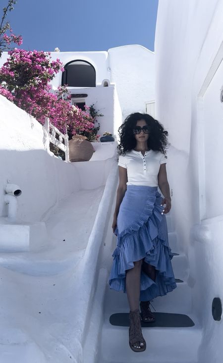 A fun midi ruffle skirt and white cotton top. I wore this in Greece and it was very comfortable. It fit the blue and white theme of the majestic volcanic cliffs in Santorini. 

#LTKSeasonal #LTKtravel #LTKmidsize