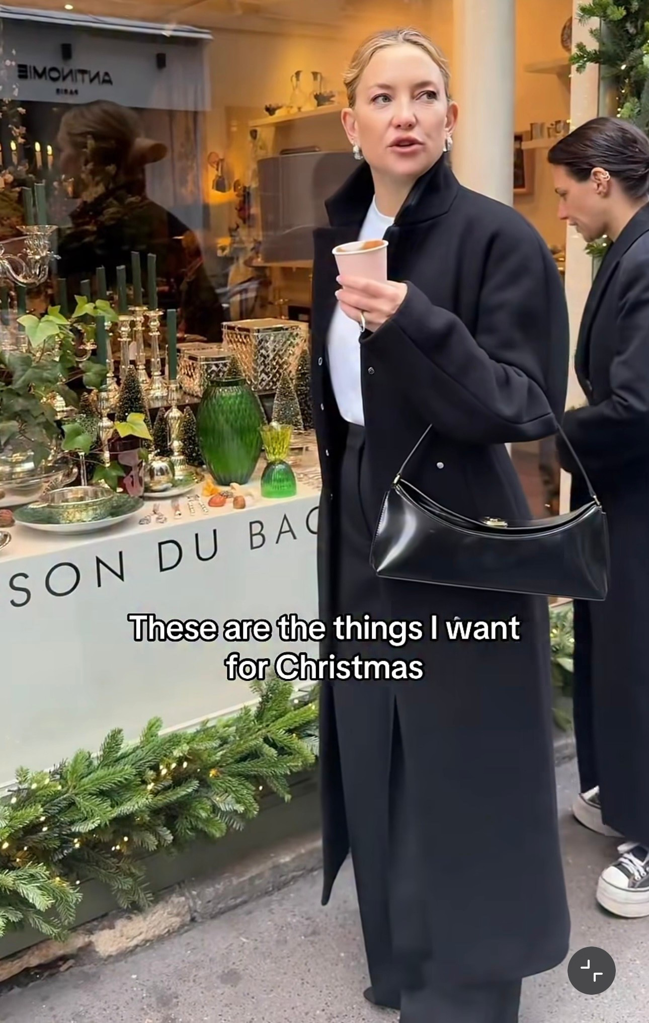 Kate Hudson's black bag crafted of leather featuring a fold-over magnetic closure and a goldtone accent.

#LTKGiftGuide #LTKHoliday