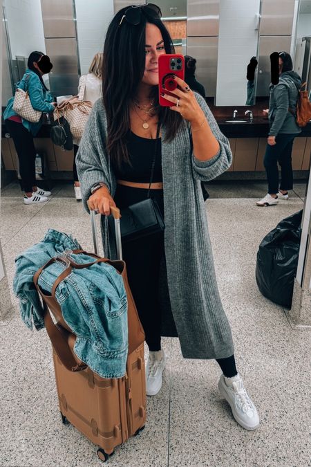 Midsize travel outfit 
Wearing an xl in the duster cardigan 
Xl in the longline sports bra 
Xl in leggings (my fave so comfy) 
White sneakers sized down a 1/2 size 
Lace trim socks Amazon 
Luggage & travel tote 

#LTKCon #LTKtravel #LTKmidsize