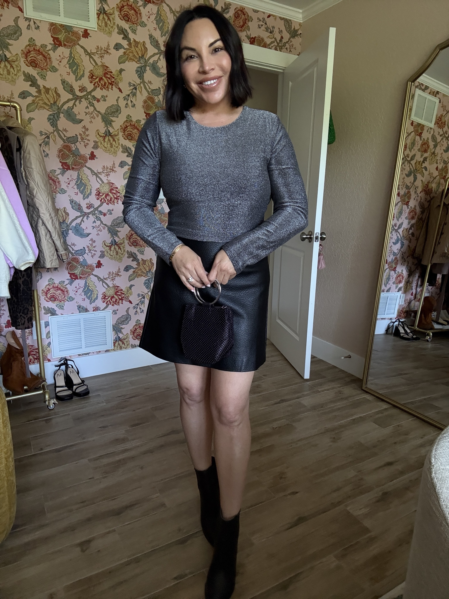 I styled this sparkly long sleeve top with a faux, leather miniskirt and black booties for a date night outfit. #fauxleather #miniskirt #datenight 

#LTKOver40 #LTKSeasonal #LTKHoliday