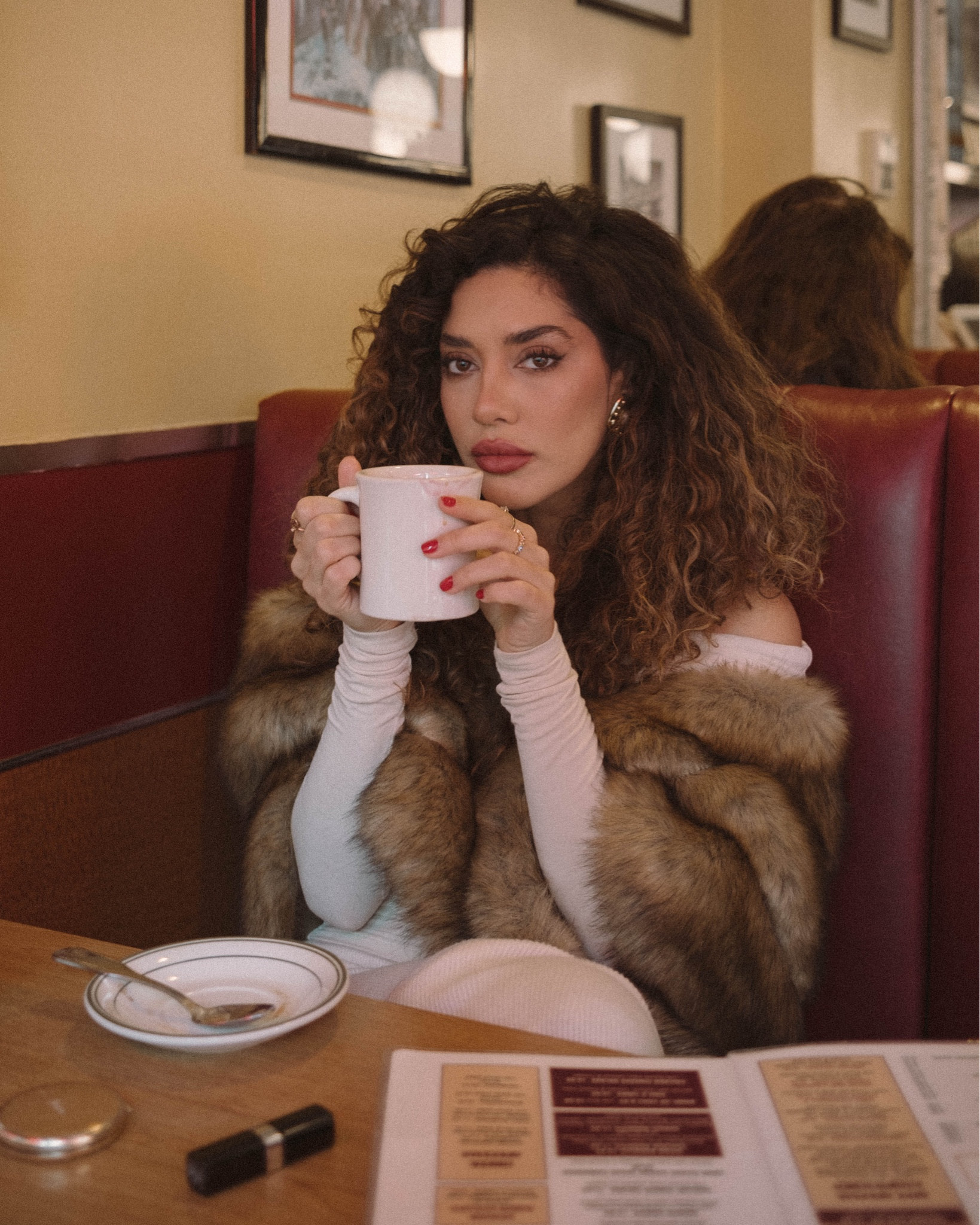 The fur shawl is giving mob wife 🥀 
I’m wearing an off shoulder top and vintage clip on earrings  