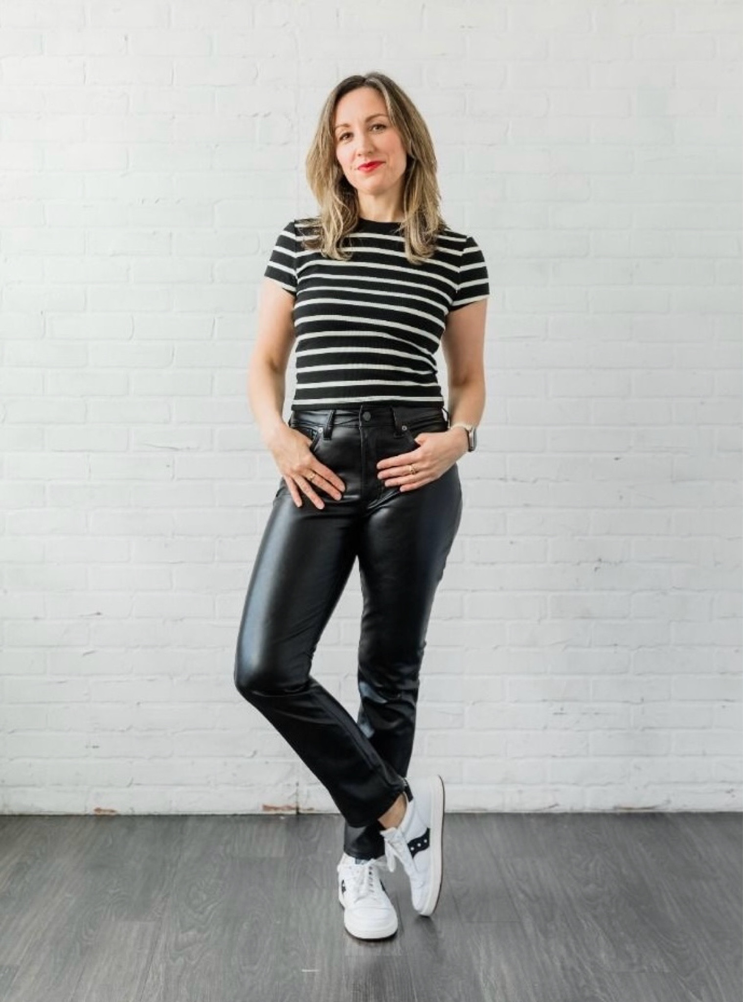 Edgy fall outfit with Stripe tee, leather back pants and white sneakers 

#LTKOver40 #LTKSeasonal