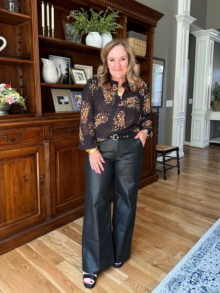Coated denim wide leg. Comes in black or brown. I’m wearing a 12 
Blouse wearing size XL and it’s very roomy. 

Great for the office or a night out  

#LTKmidsize #LTKSeasonal #LTKworkwear