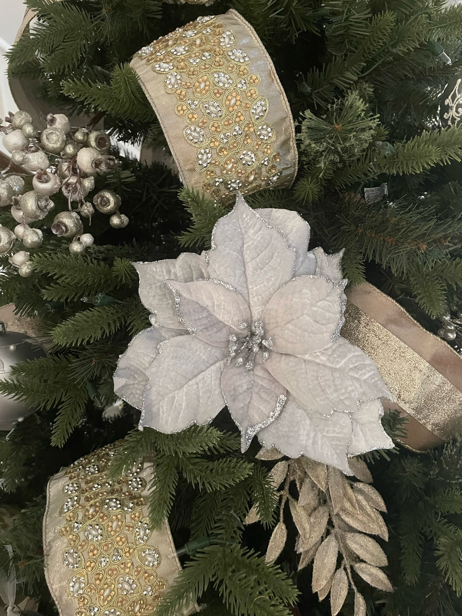 I found very similar poinsettia flower clip ons!! They are also on sale now so make sure to grab them! Mine were originally from Pier 1 a few years ago 🤍

#LTKSeasonal #LTKHoliday #LTKhome