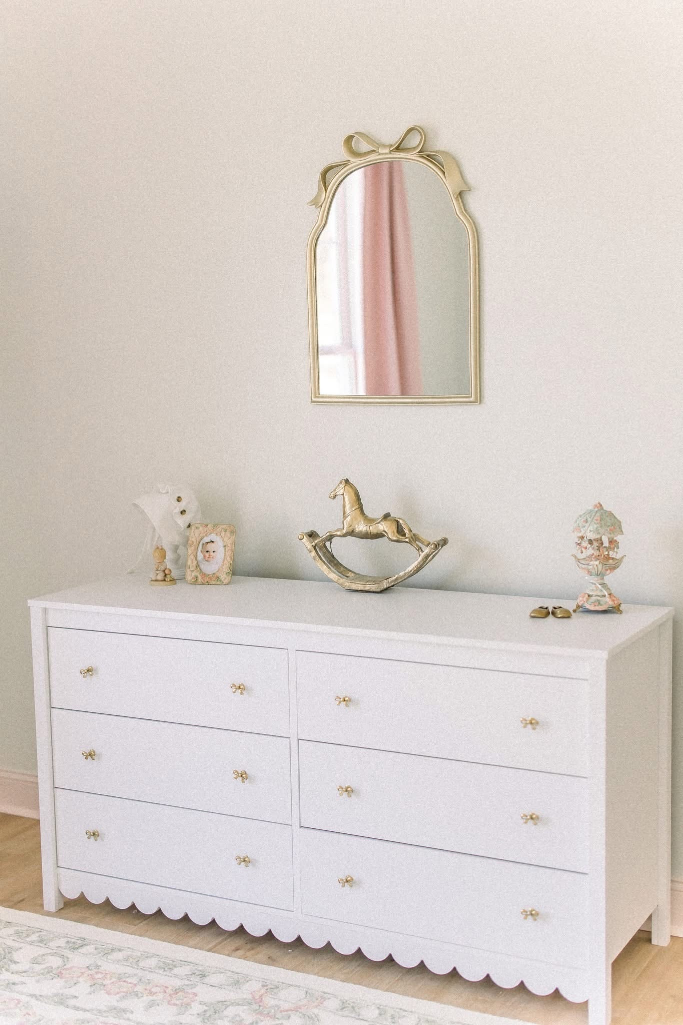 Baby girl nursery bedroom scalloped dresser with bow knobs added 

#LTKBaby #LTKmomlife #LTKKids
