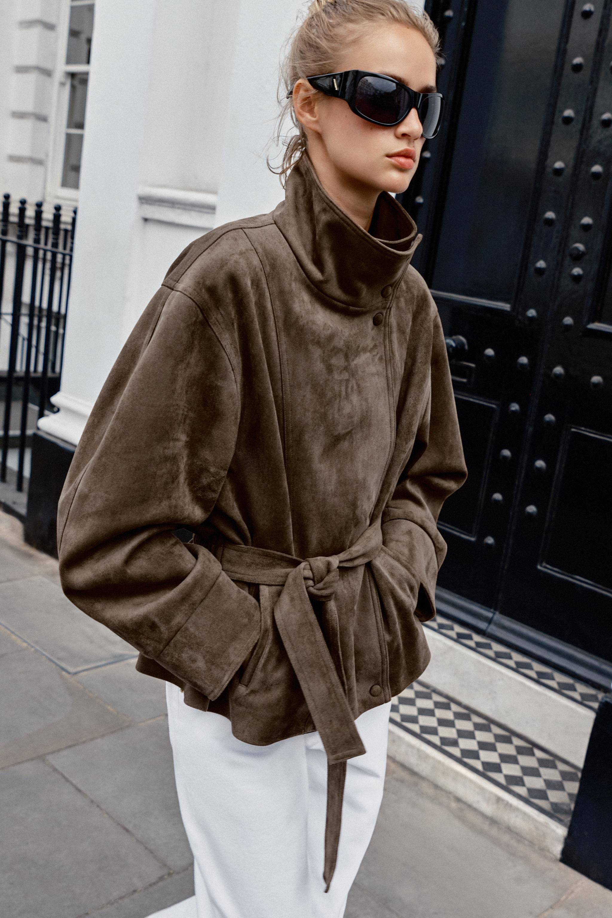 Jacket with a high collar and long sleeves. Front pockets. Featuring a matching fabric belt and g... | Zara FR