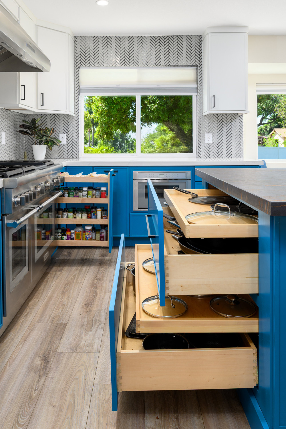 A beautiful kitchen starts with smart design behind the doors. This remodel features full-extension pull-out spice racks and deep pot drawers with lid organizers—because staying organized shouldn’t be an afterthought. Paired with bold blue cabinetry and a sleek herringbone backsplash, this space proves functionality and style go hand in hand.

Our design-build team handles every detail—from space planning to cabinetry supply and expert installation—so your kitchen works as beautifully as it looks.

Love what you see? Save this for remodel inspiration!

#KitchenStorage #CustomCabinetry #PotDrawers #SpiceRack #KitchenOrganization #DesignBuild #KitchenDesign #BoldCabinetry #LTKHome #LTKKitchen #KitchenInspo #FullServiceRemodel #SmartStorage #DrawerOrganization #HomeRenovation #BlueCabinets #HerringboneTile #KitchenGoals #InteriorDesign #KitchenRemodel #StorageSolutions #CaliforniaDesign #FunctionalKitchen #DreamKitchen #CustomStorage 

 #LTKHome