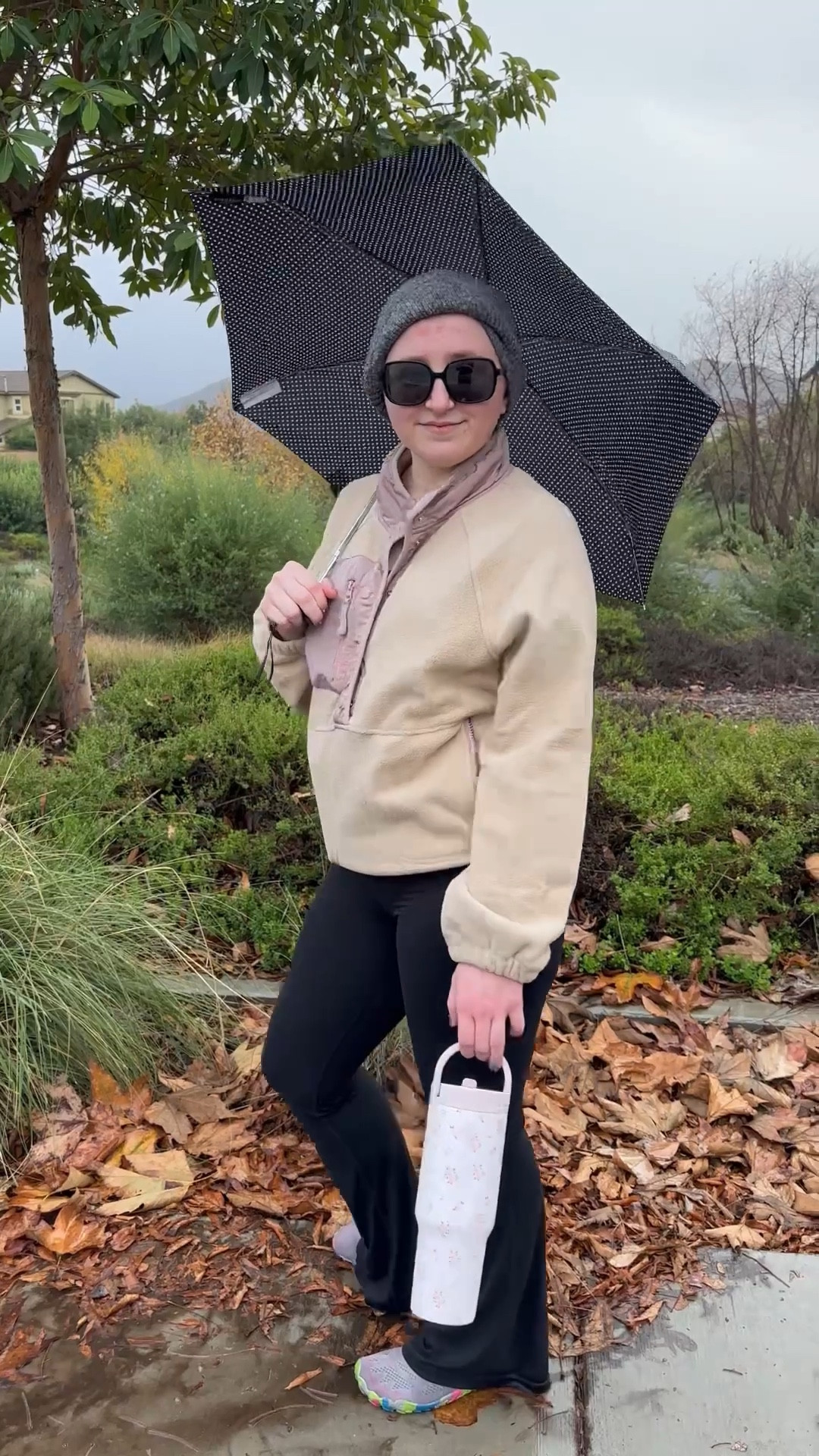 Ditched the cozy bed for a puddle symphony! ☔️ My trusty black and white polka dot umbrella is on duty, while this camel sweatshirt (with pop of pink!) is my perfect rainy day wellness walk outfit. Who else chooses a morning walk in the rain for their daily dose of mental health and fresh air? 🤣 #VitaminRain

Tell me: coffee first, or brave the rain like me? 💬

#MorningWalk #RainyDayWalk #WellnessJourney #PolkaDotUmbrella #ComfortStyle

#LTKMidsize #LTKActive #LTKOver40
