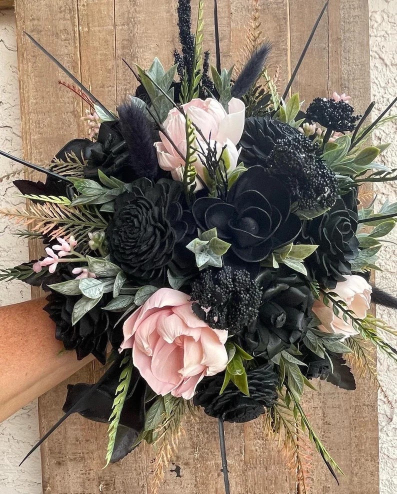 Make a bold, unforgettable statement walking down the aisle with this dramatic black and blush bouquet by ForeverFlowersbyGigi. Deep black sola wood flowers create a moody, romantic base, while soft blush peonies add the perfect touch of contrast and elegance. Designed for brides who love a gothic, modern, or edgy aesthetic, this bouquet is lightweight, allergy-friendly, and crafted to last forever—no wilting, no worries. With customizable shades of pink, multiple size options (including cascade), scent choices, and coordinating accessories available, it’s easy to create a full wedding look that feels uniquely yours.

#LTKWedding #GothicBride #SolaWoodFlowers #MoodyWedding #AlternativeBride #BlushAndBlack #WeddingInspo #BridalBouquet

#LTKHome #LTKWedding #LTKSeasonal