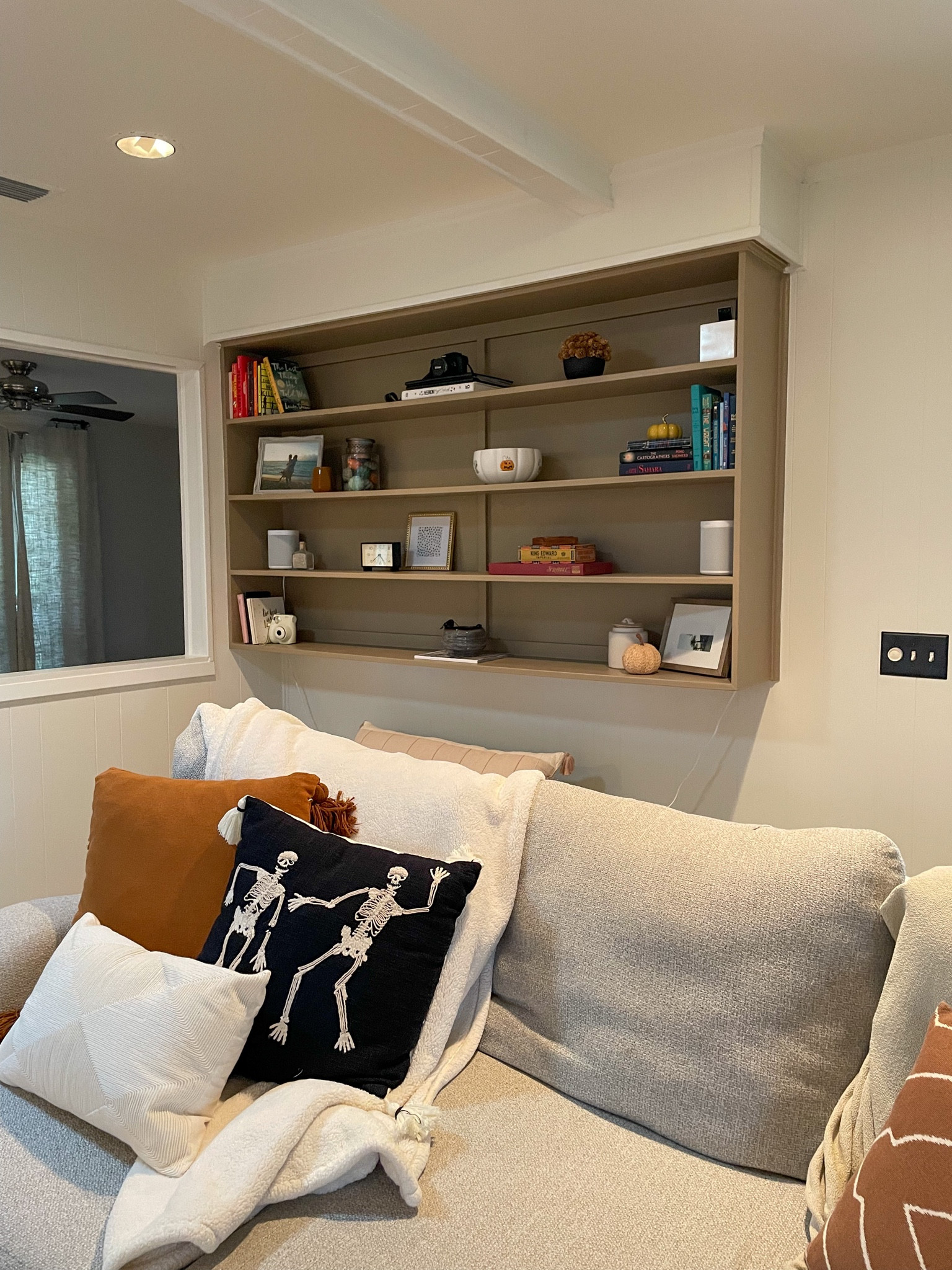 living room bookcase + knickknacks with fall/Halloween decor  

#LTKSeasonal #LTKHoliday #LTKhome