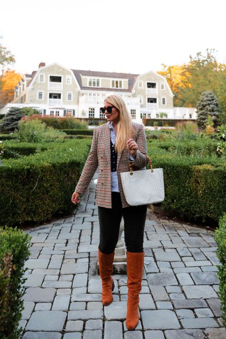 Fall travel style: Houndstooth blazer, blue & white striped ruffle shirt, navy cashmere cable knit vest, hunter green corduroy pants, chestnut suede knee high boots, tortoise sunglasses, white ostrich print leather bamboo handle bag, j crew, Tuckernuck, mark and Graham, Nordstrom

#LTKSeasonal #LTKitbag #LTKover40