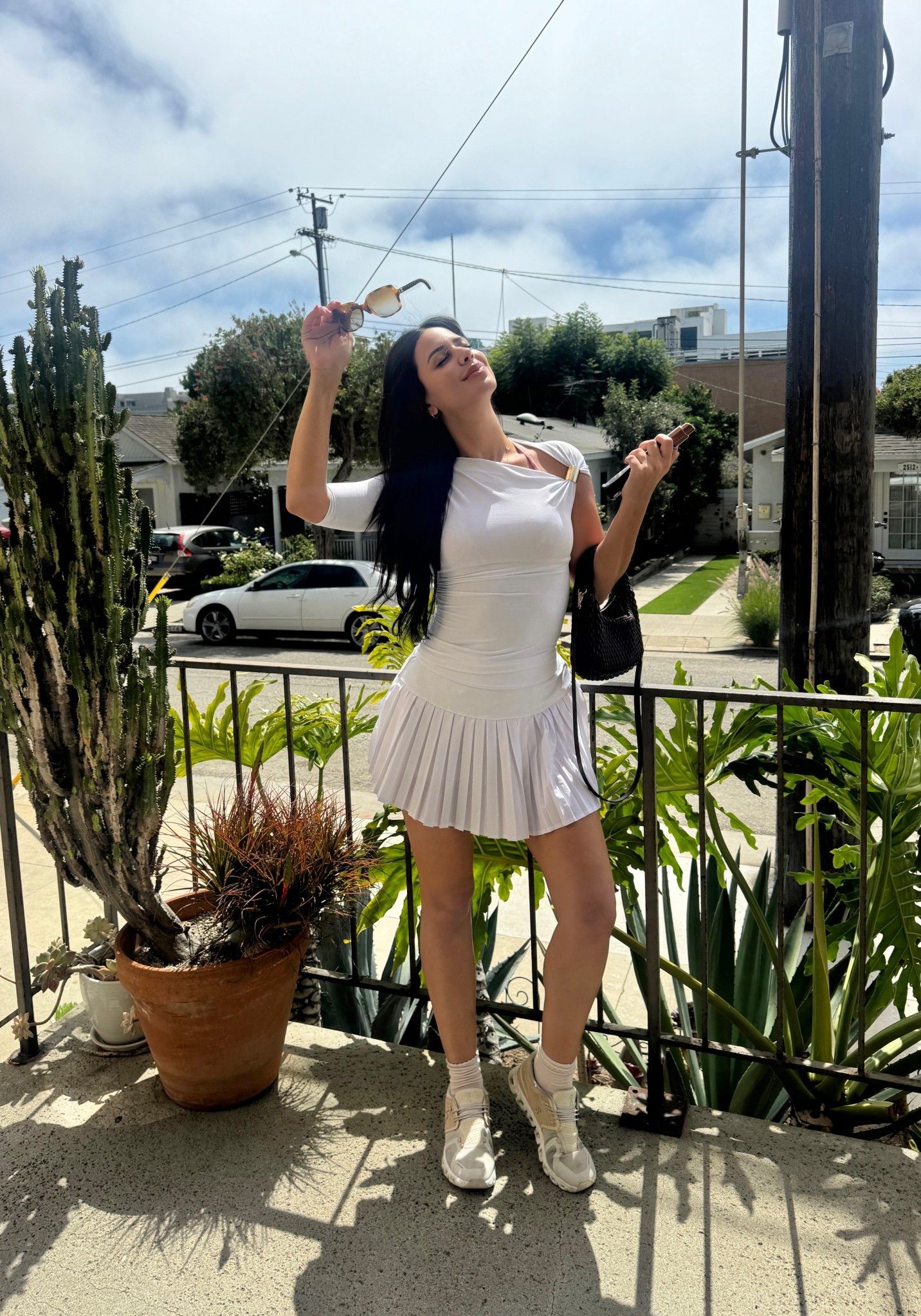 Tennis girl outfit with the skirt and draped top, quilted bag and on cloud 6 favorite sneakers 

#LTKstyletip #LTKsale #LTKshoes