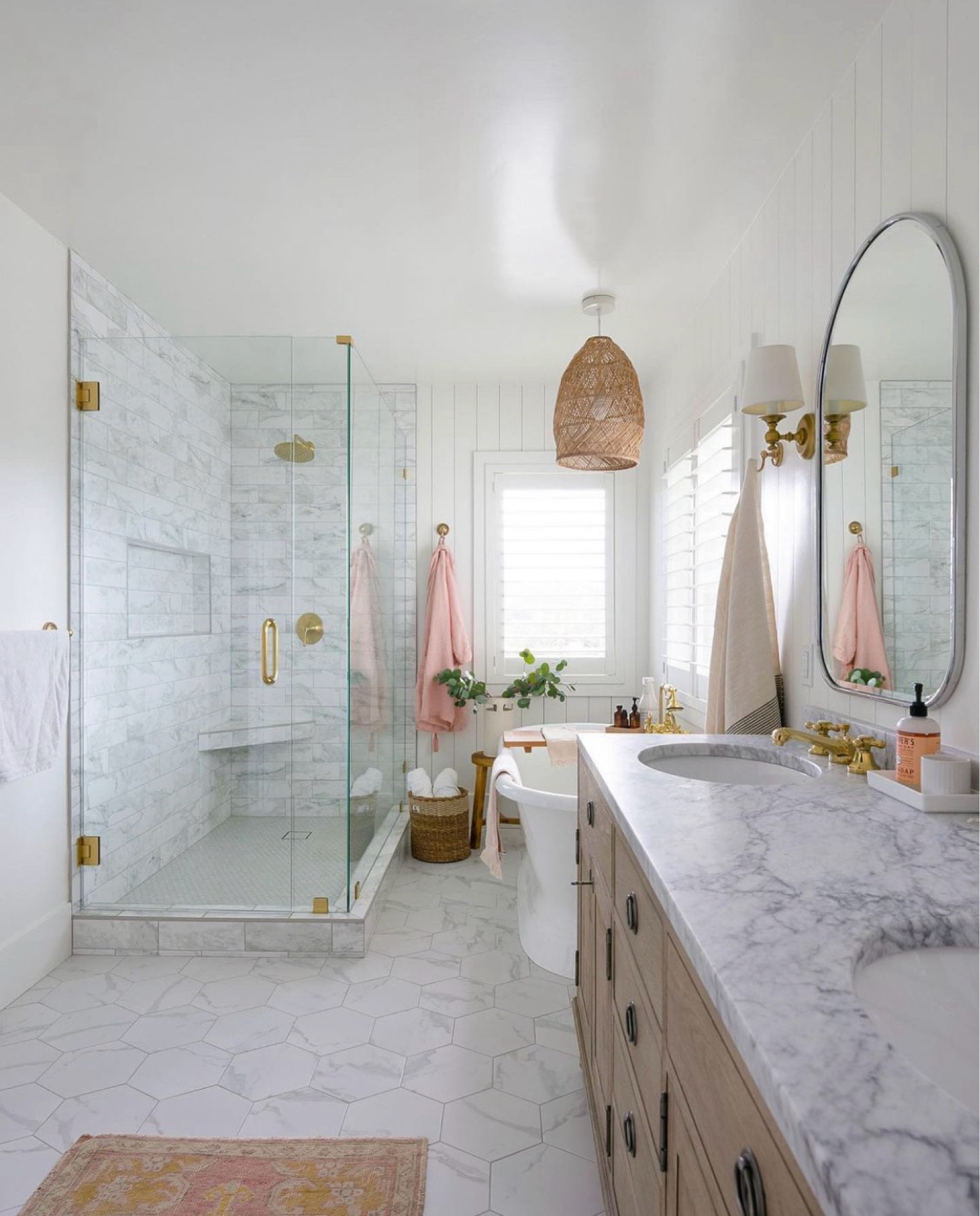 This neutral bath is full of natural light. The light fixtures and vanity bring warmth and texture to the space.  The vintage rug ties it all together and adds so much charm.

Vintage rug is from peony + olive
www.peonyandolive.com/collections/rugs

Robe is the one linked, but they don’t sell the pink anymore 

#LTKhome