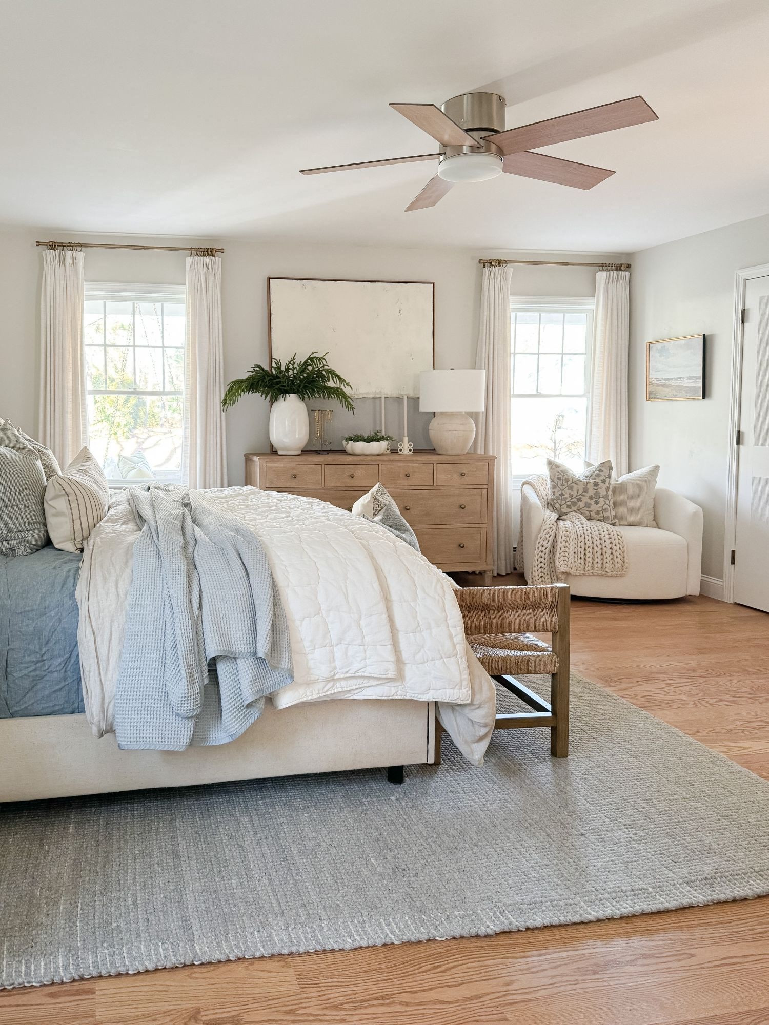 A cozy coastal winter bedroom with crisp white bedding, subtle blue tones, and warm woven textures at the foot of the bed. This space feels calm, clean, and effortlessly inviting. Winter bedroom, coastal bedroom decor, coastal winter bedroom, neutral bedding, woven bench, textured bedding, serene bedroom, layered bed styling, cozy coastal home, soft winter tones

#LTKHoliday #LTKHome #LTKSeasonal