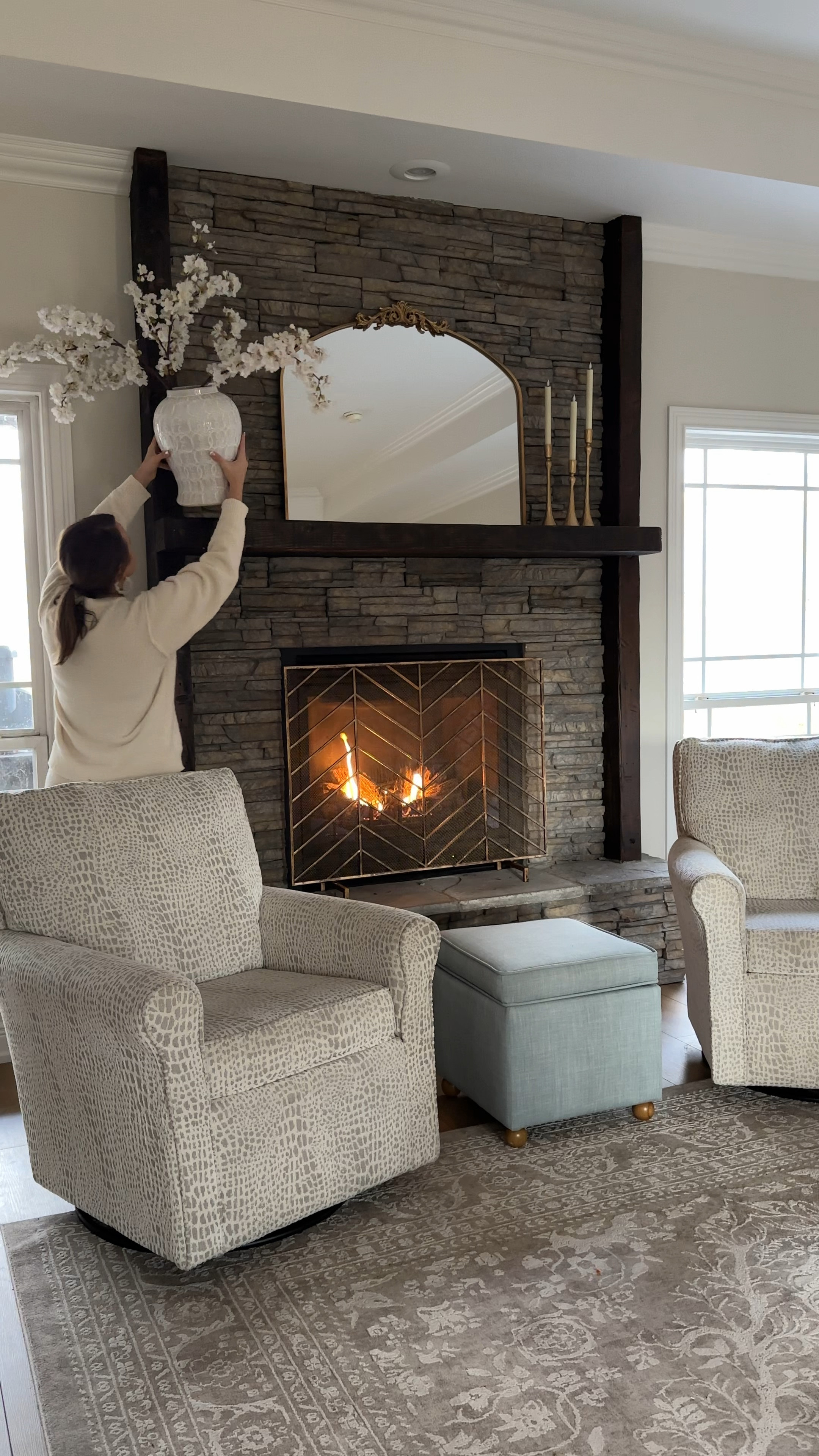 Spring mantle decor refresh!!! Feat. Our new gold ornate mirror! 😍 What do we think about this mirror, candles and vase combo for above the fireplace? I’ll probably re arrange 18192 more times before I settle honestly lol but I’m loving it so far!! Linking our living room furniture, fireplace decor, swivels couches & coffee table too! 

Spring decor, home decor, mantel refresh, living room, vases, faux florals, cherry blossoms, home design, stone fireplace 

#LTKFamily #LTKHome #LTKStyleTip