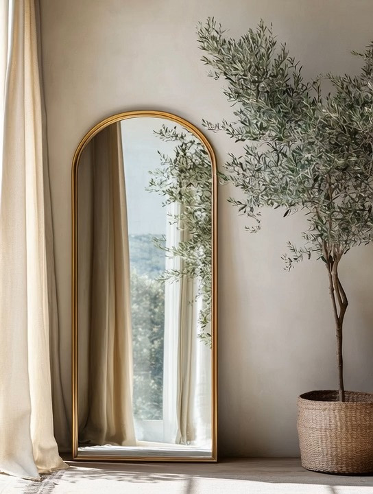 A timeless arched mirror with a soft rounded top is one of those design pieces that never goes out of style. Leaned casually against the wall, it adds height, light, and effortless elegance to any space. Paired with a sculptural olive tree, this setup creates a calm, organic moment that works beautifully in a bedroom, living room, hallway, or even an empty corner that needs intention. Natural light reflecting through the mirror instantly brightens the room, while the greenery adds warmth and texture. Beyond styling, this look also creates the perfect everyday selfie spot—clean, minimal, and flattering—proving that thoughtful decor can be both functional and beautiful. @Wayfair @Target
#archedmirror #homedecor #quietluxury 



#LTKHome