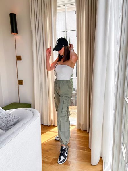 Love this look for a casual running errands on a spring day! Top is a seamless tube top and pants are high rise baggy cargo pants from Abercrombie. Cargo pants are a size 27 long! Love the baggier fit. You can also pair these with baby pink, black, khaki etc!

#LTKSeasonal #LTKfindsunder100 #LTKstyletip